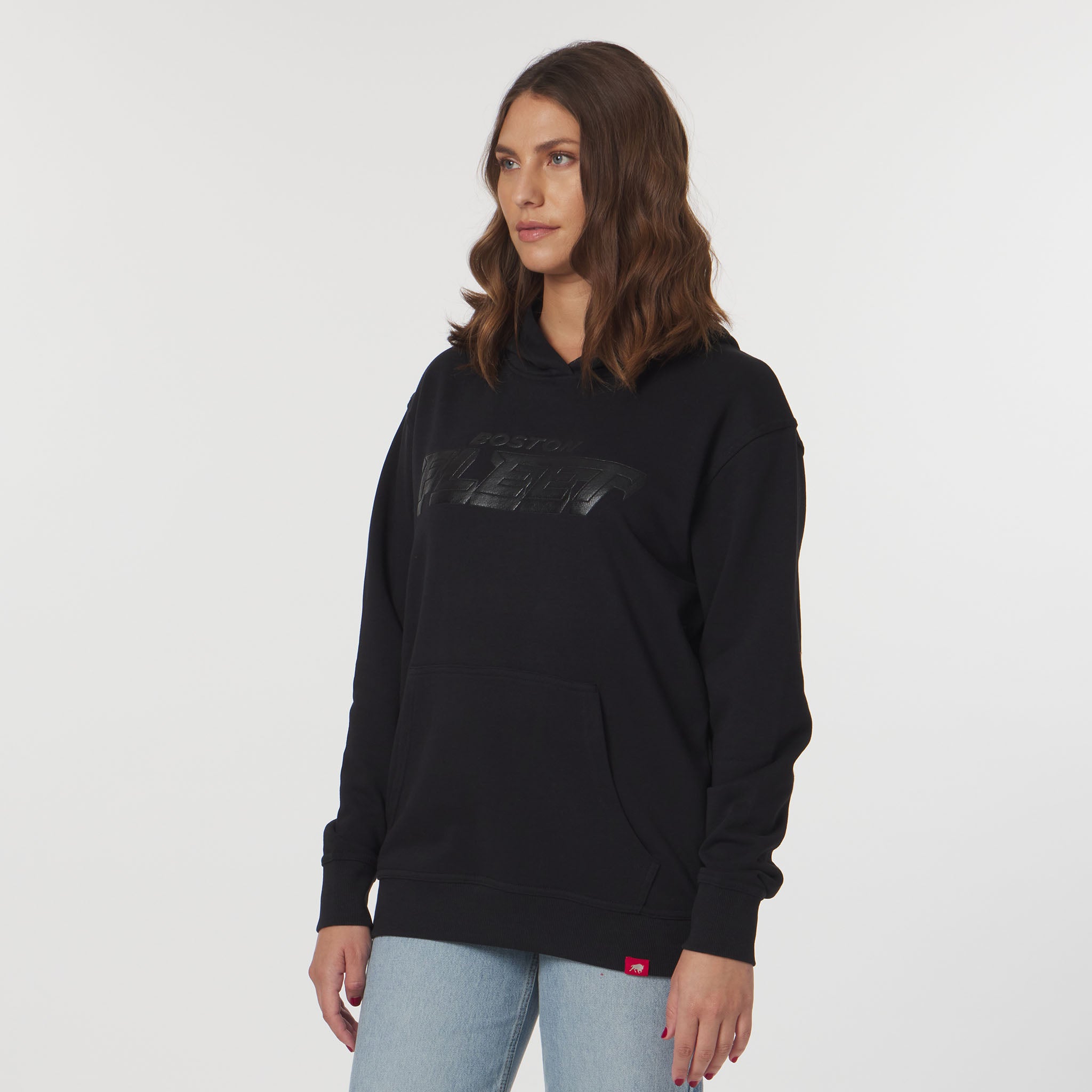 Woman wearing a black hoodie with a logo on a white background