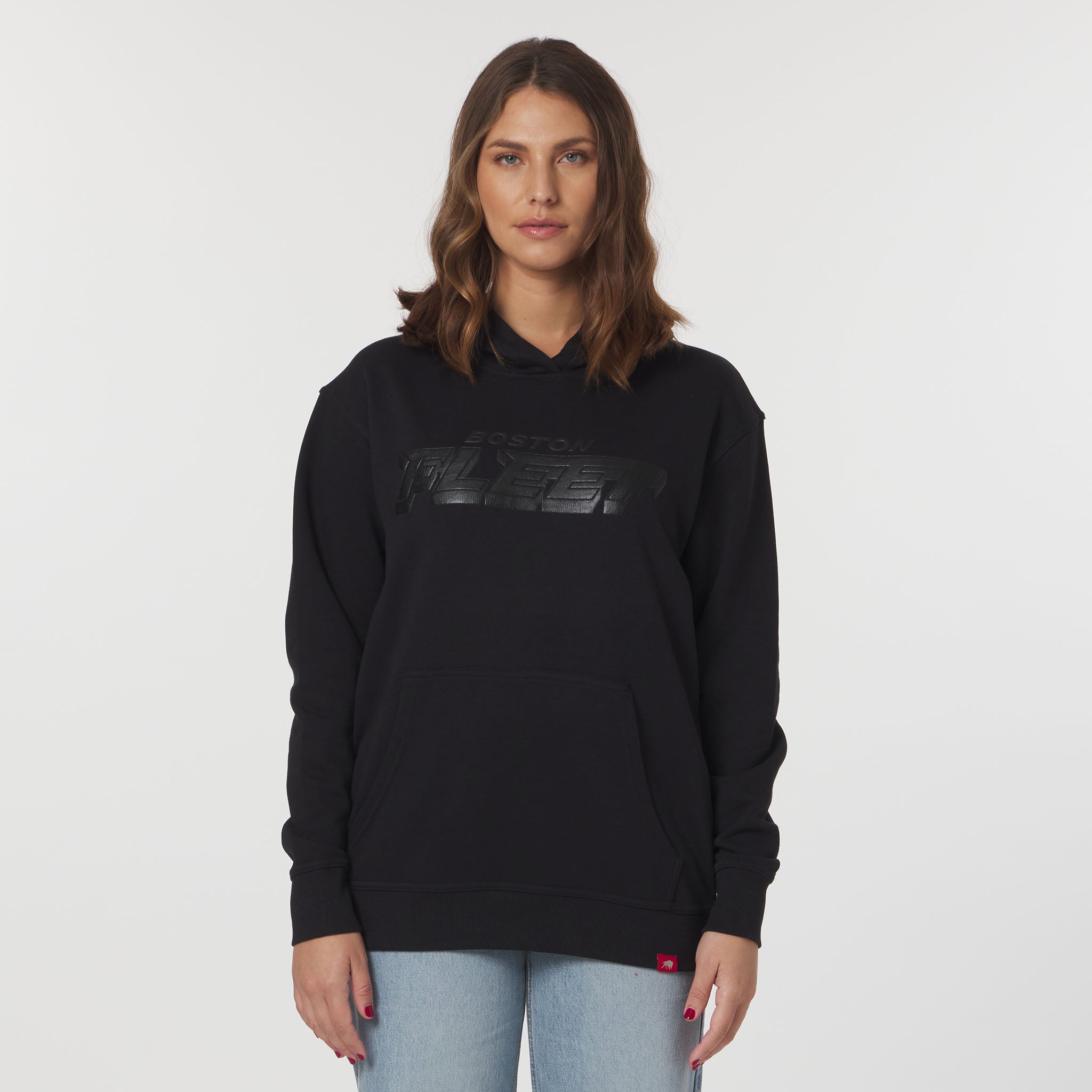 Woman wearing a black hoodie with a logo on a white background