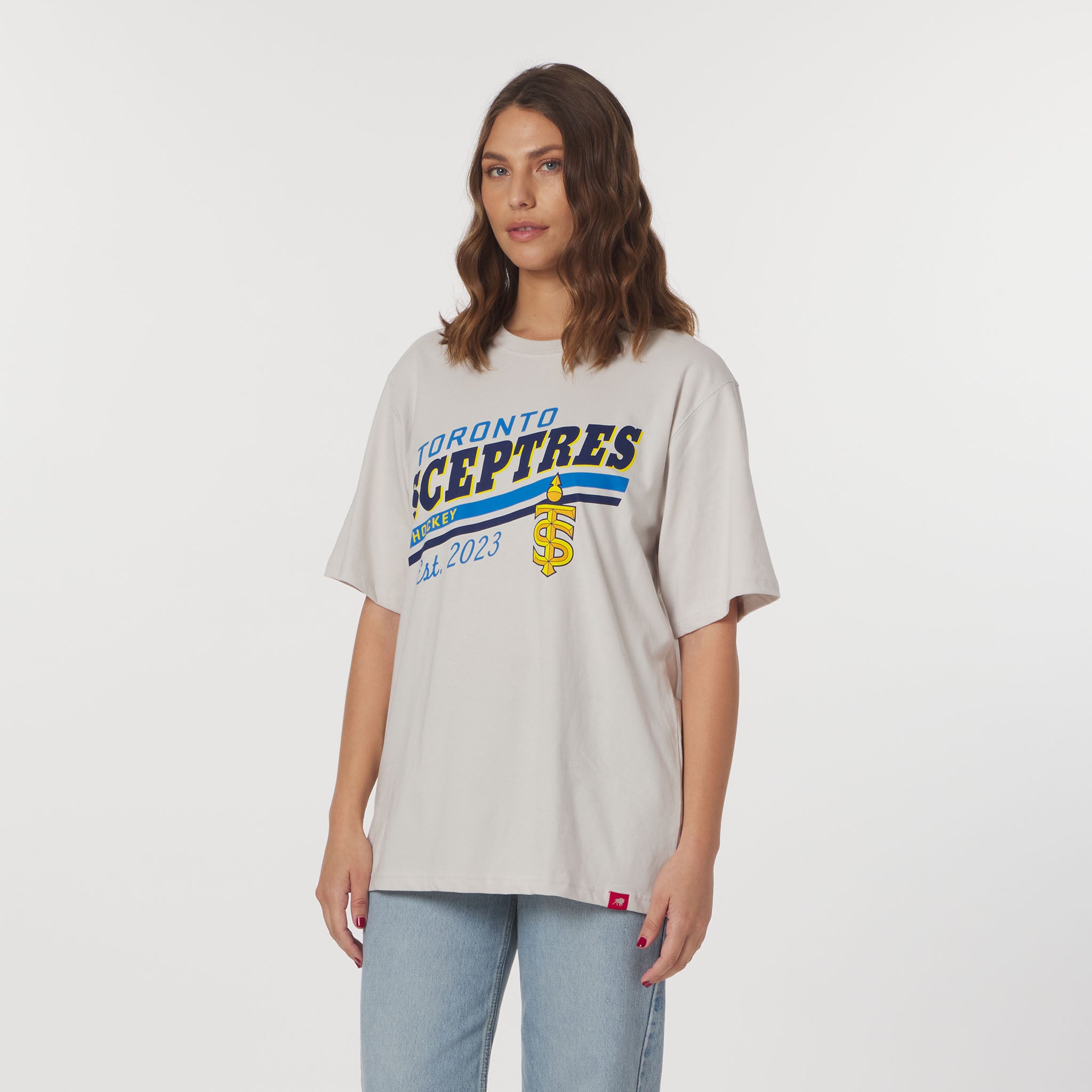 Woman wearing a 'Toronto Sceptres' t-shirt on a white background