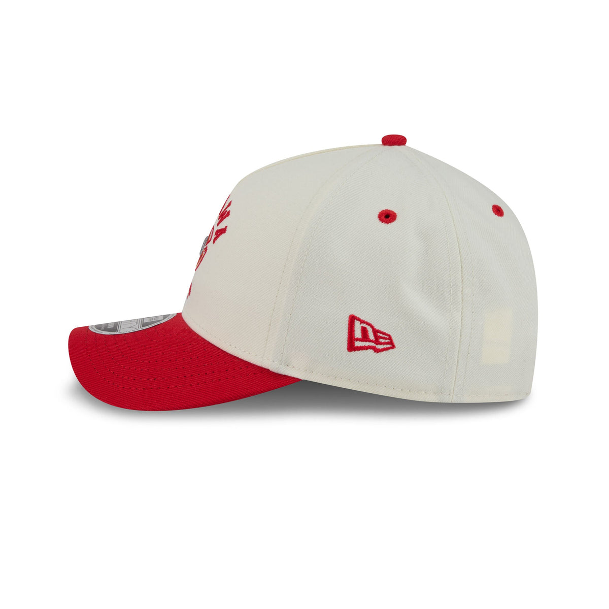 A New Era baseball cap in off-white and red, shown from a three-quarters side angle on a clean white background. The cap features a structured off-white crown with red eyelets and a red New Era logo on the side, paired with a solid red visor and red button on top.