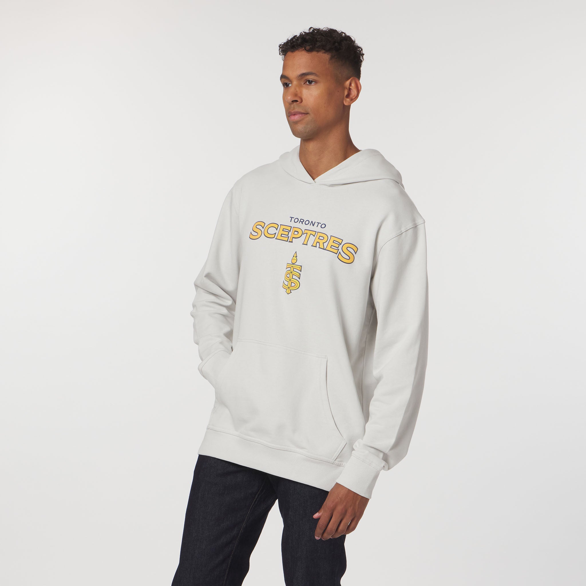 Man wearing a light gray hoodie with 'Toronto Sceptres' text and logo on a white background