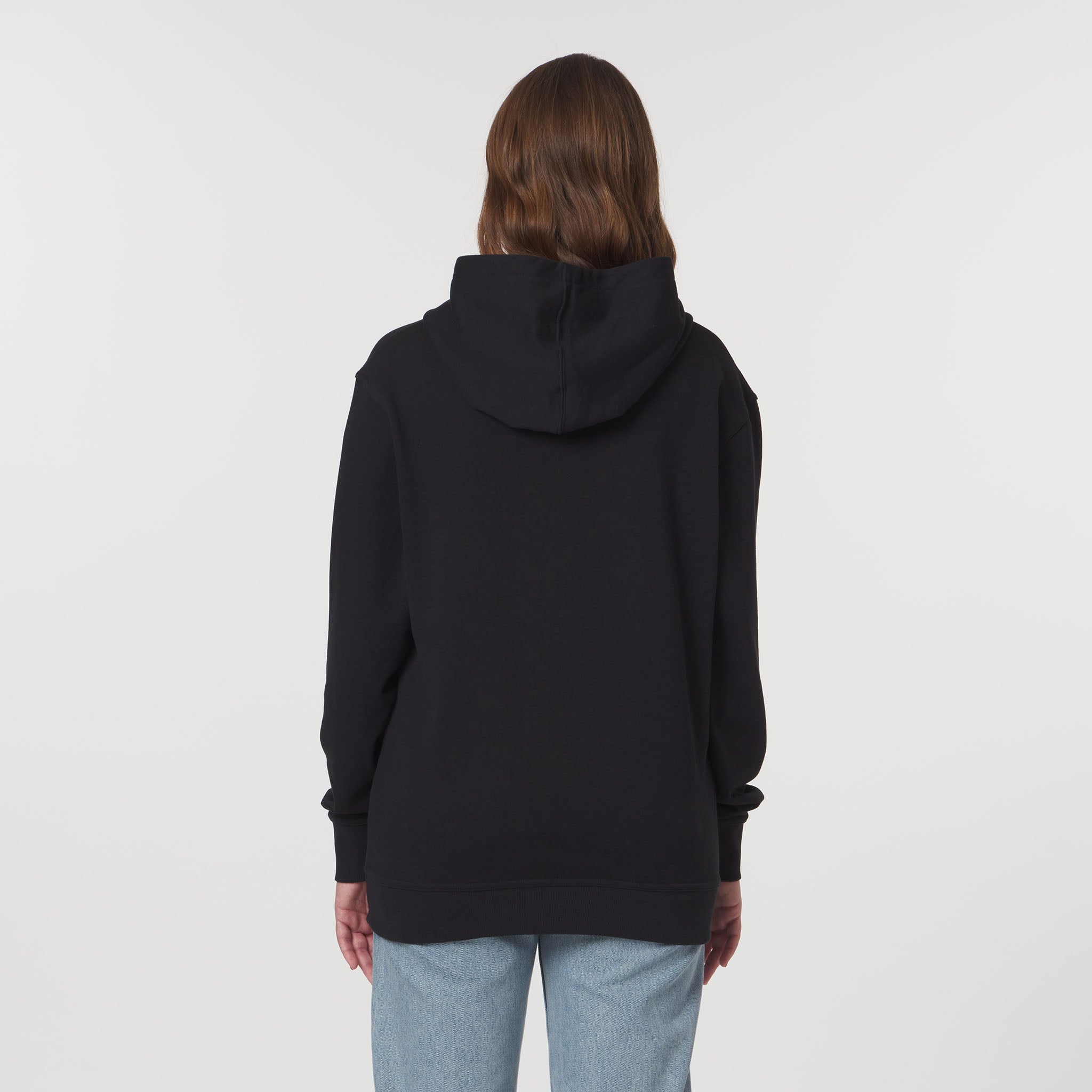 Person wearing a black hoodie from behind on a plain background