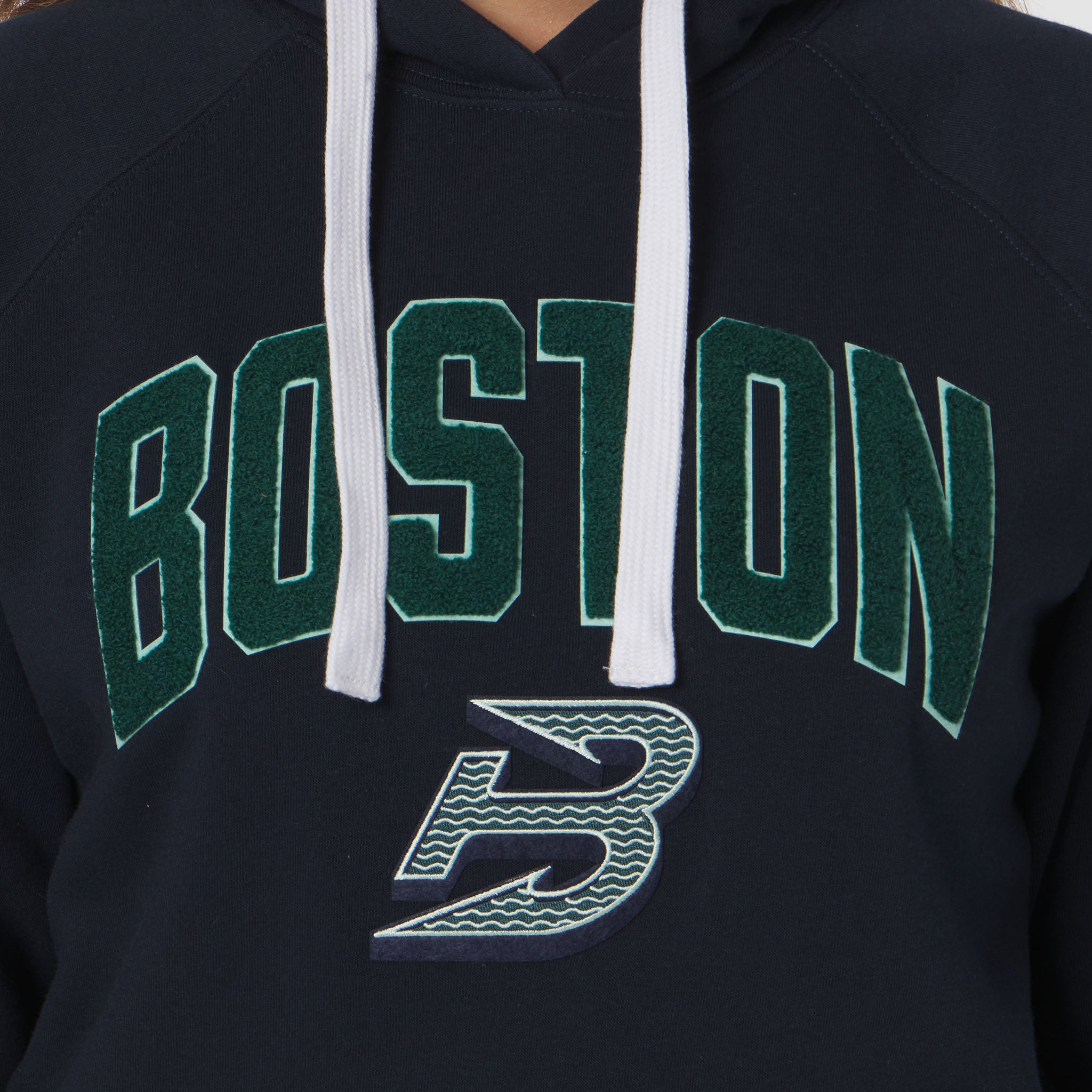 Black hoodie with 'Boston' text and logo on a person wearing it.
