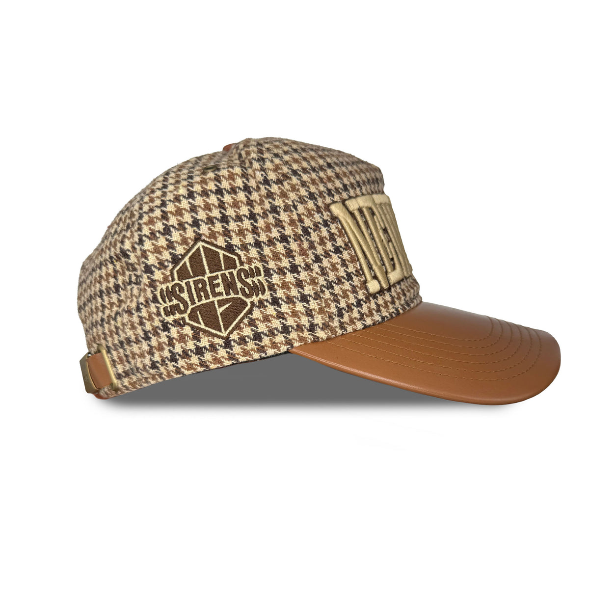 The side of a tan houndstooth hat with a brown leather brim. It is embroidered with a tan and brown New York Sirens logo. 