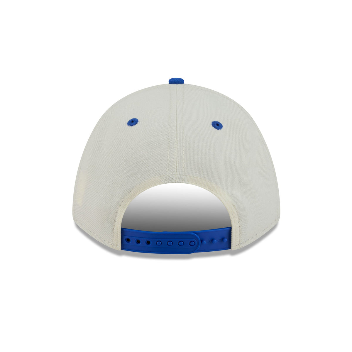 The back view of a baseball cap featuring an off-white crown with blue button details and a blue adjustable strap.