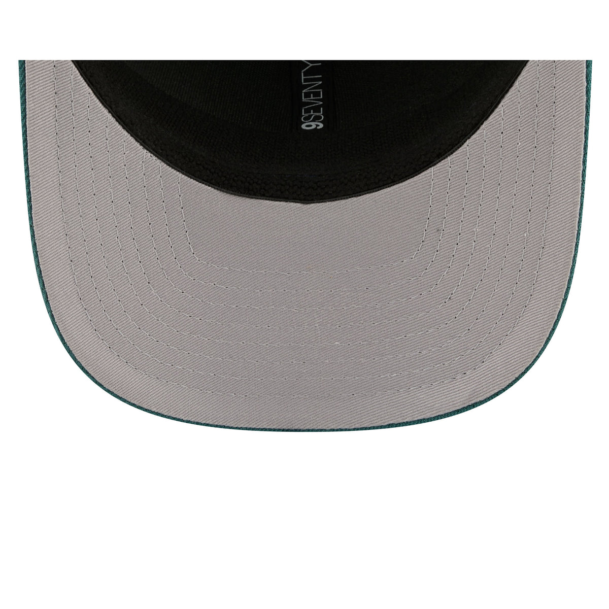 A light gray under brim of Seattle Torrent hat.