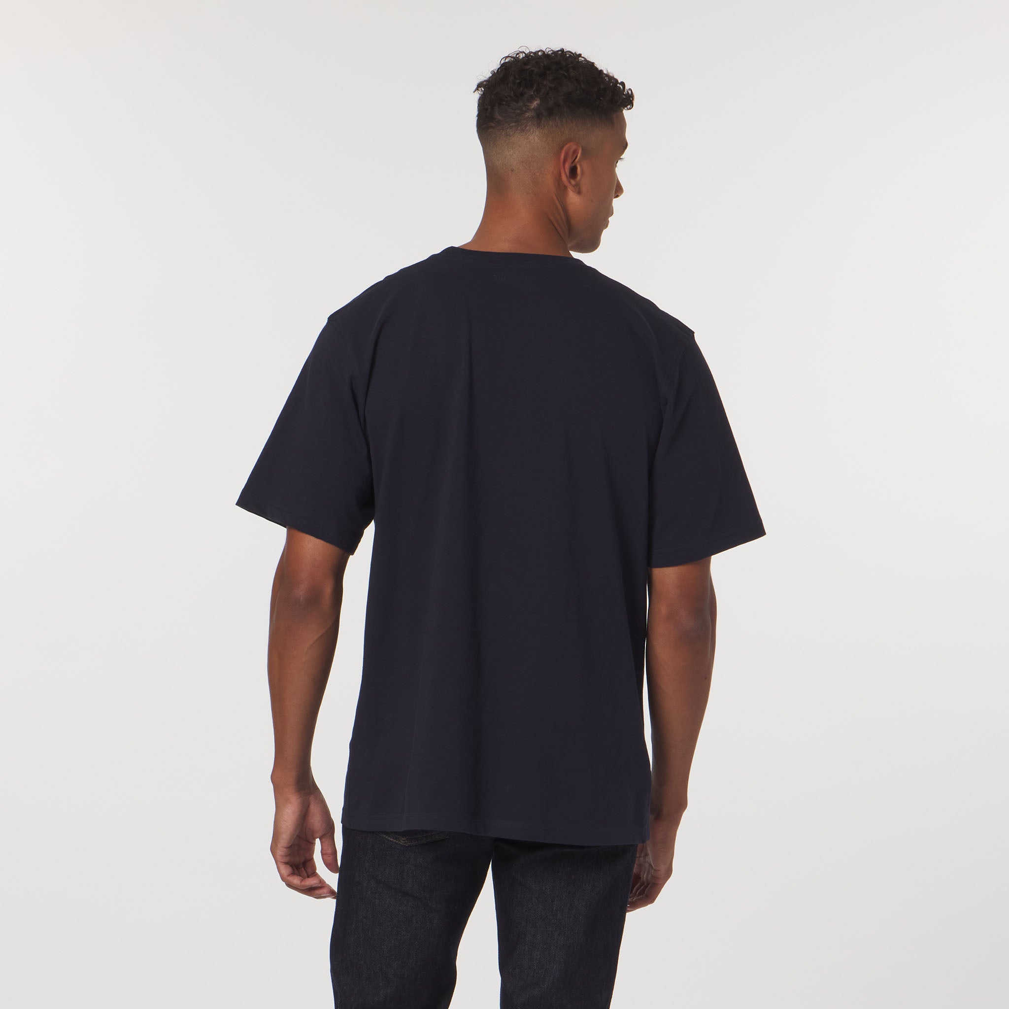 Man wearing a black t-shirt on a white background