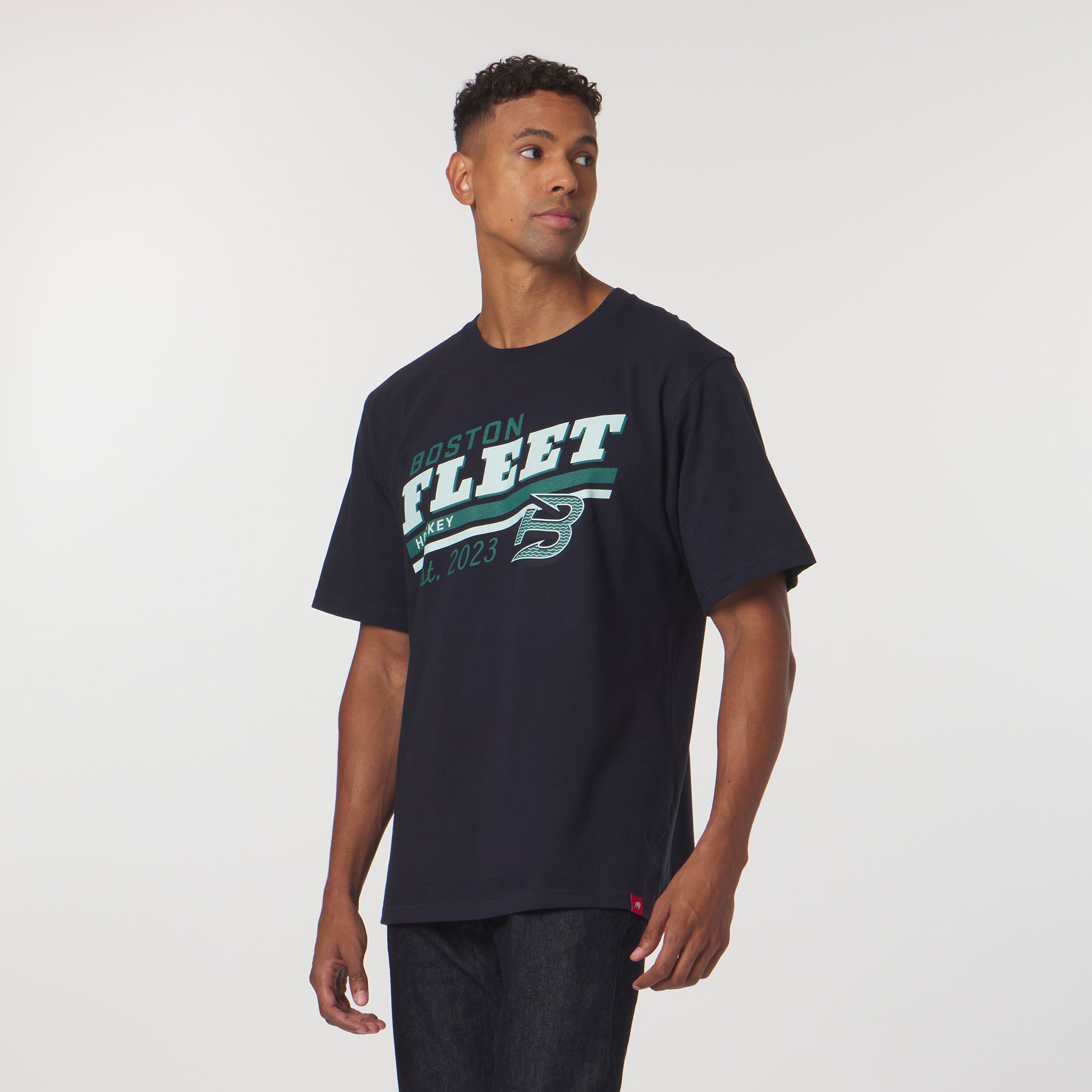 Man wearing a navy blue t-shirt with 'Boston Fleet' text and logo on a white background