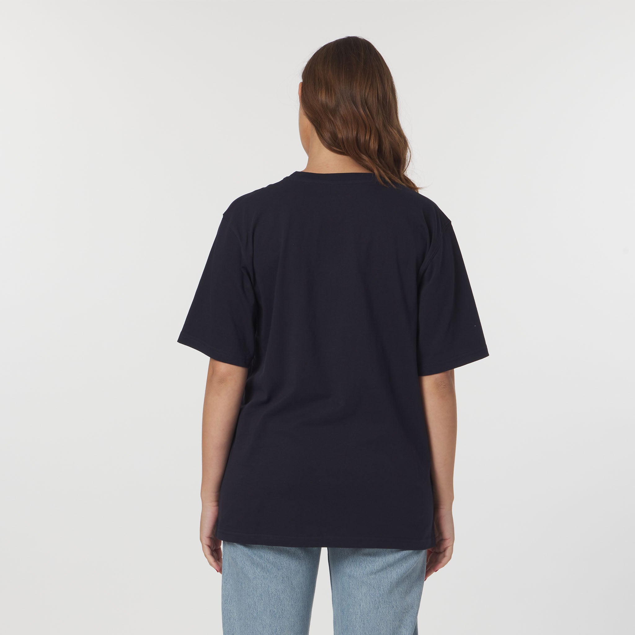 Person wearing a black t-shirt on a plain background