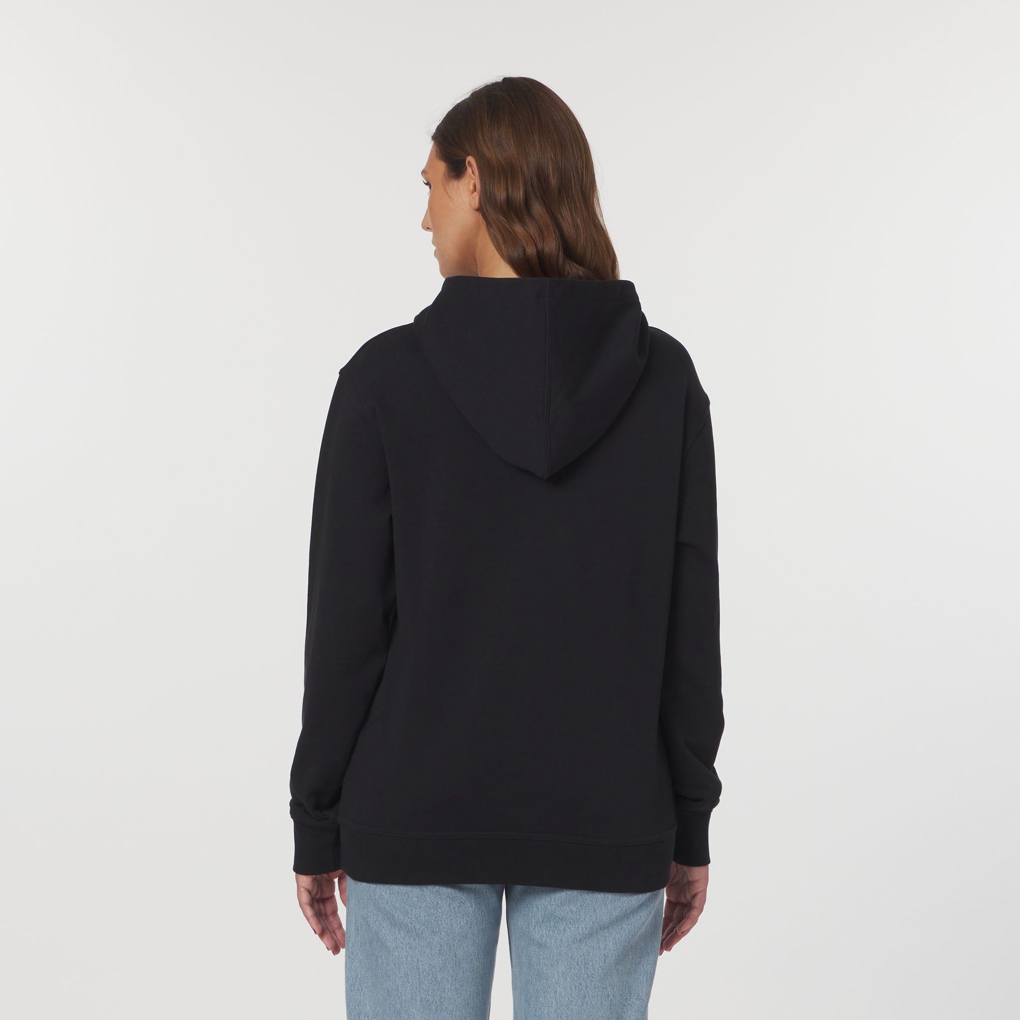 Person wearing a black hoodie from behind on a white background