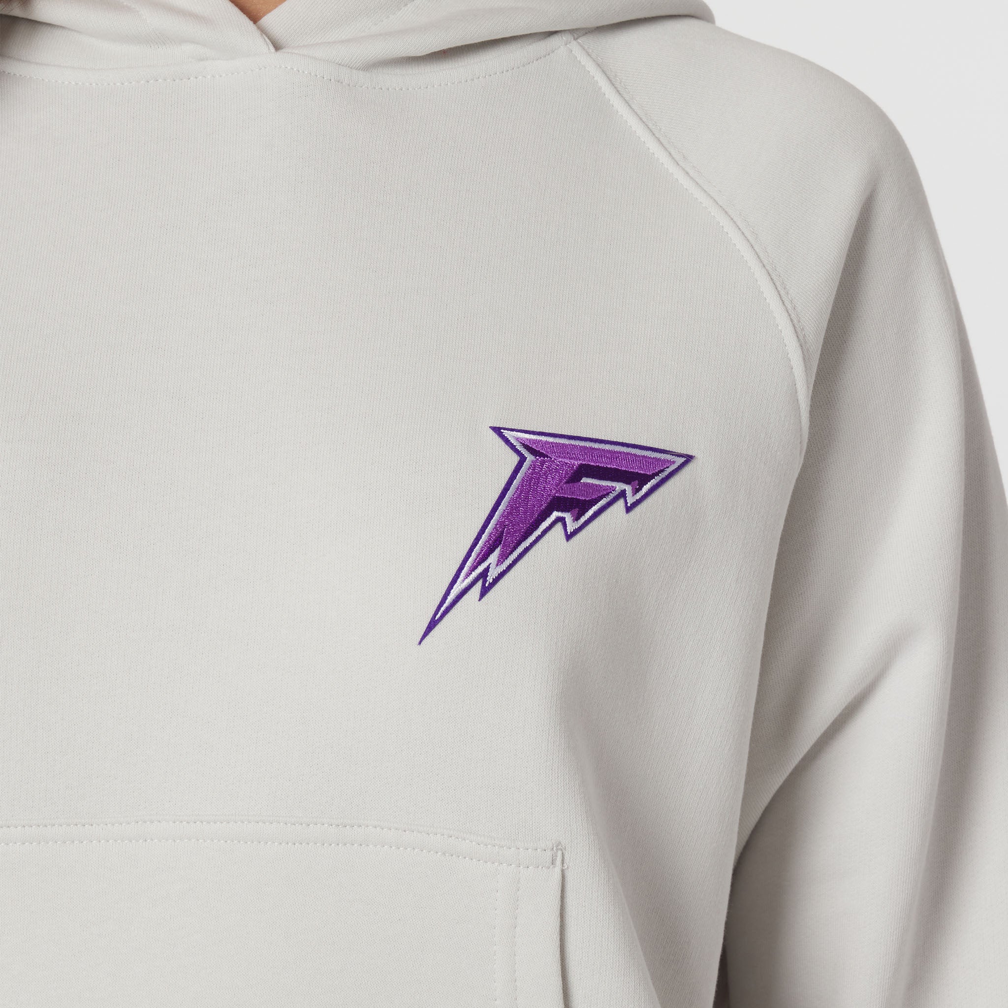 Light gray hoodie with a purple logo on a white background