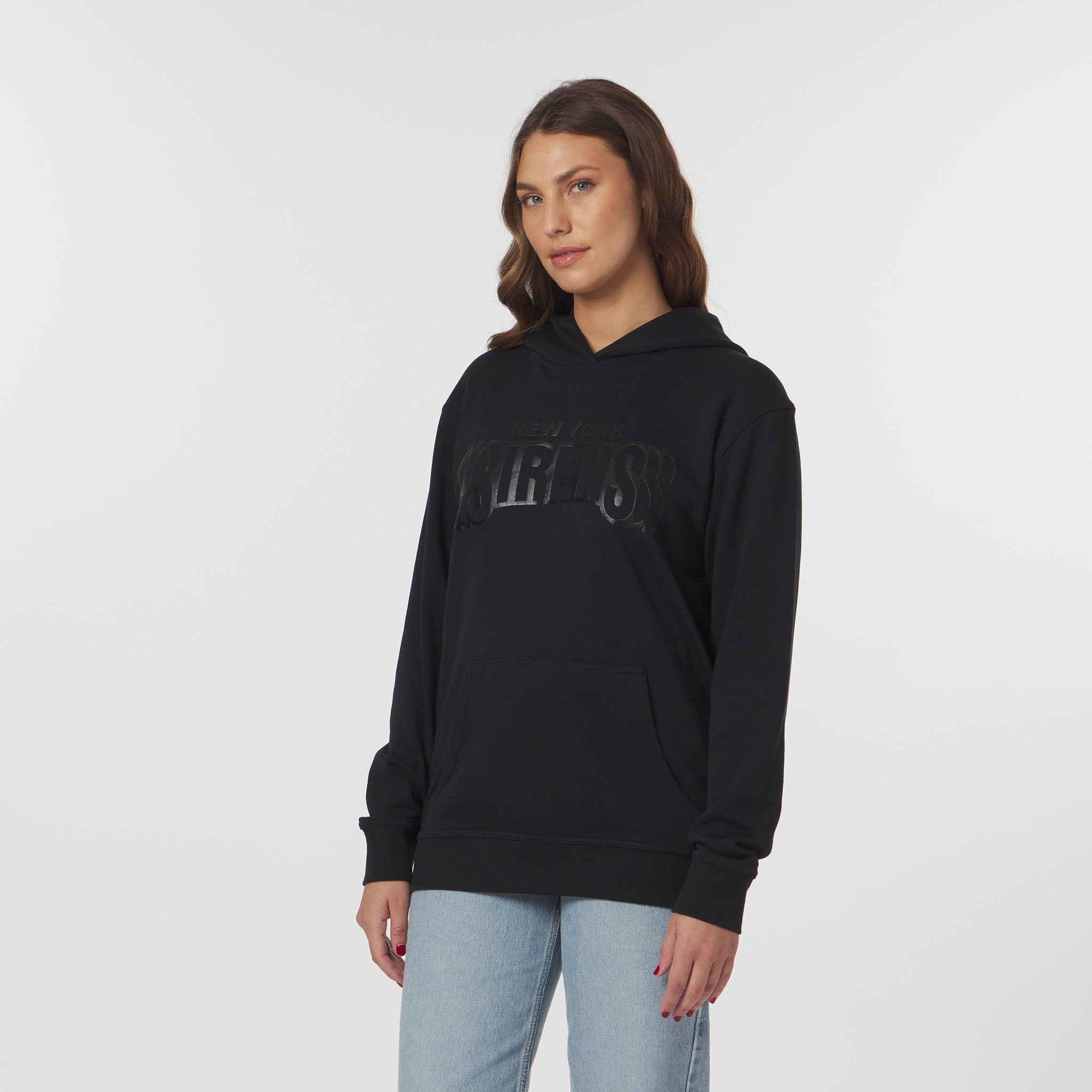 Woman wearing a black hoodie with text on a white background