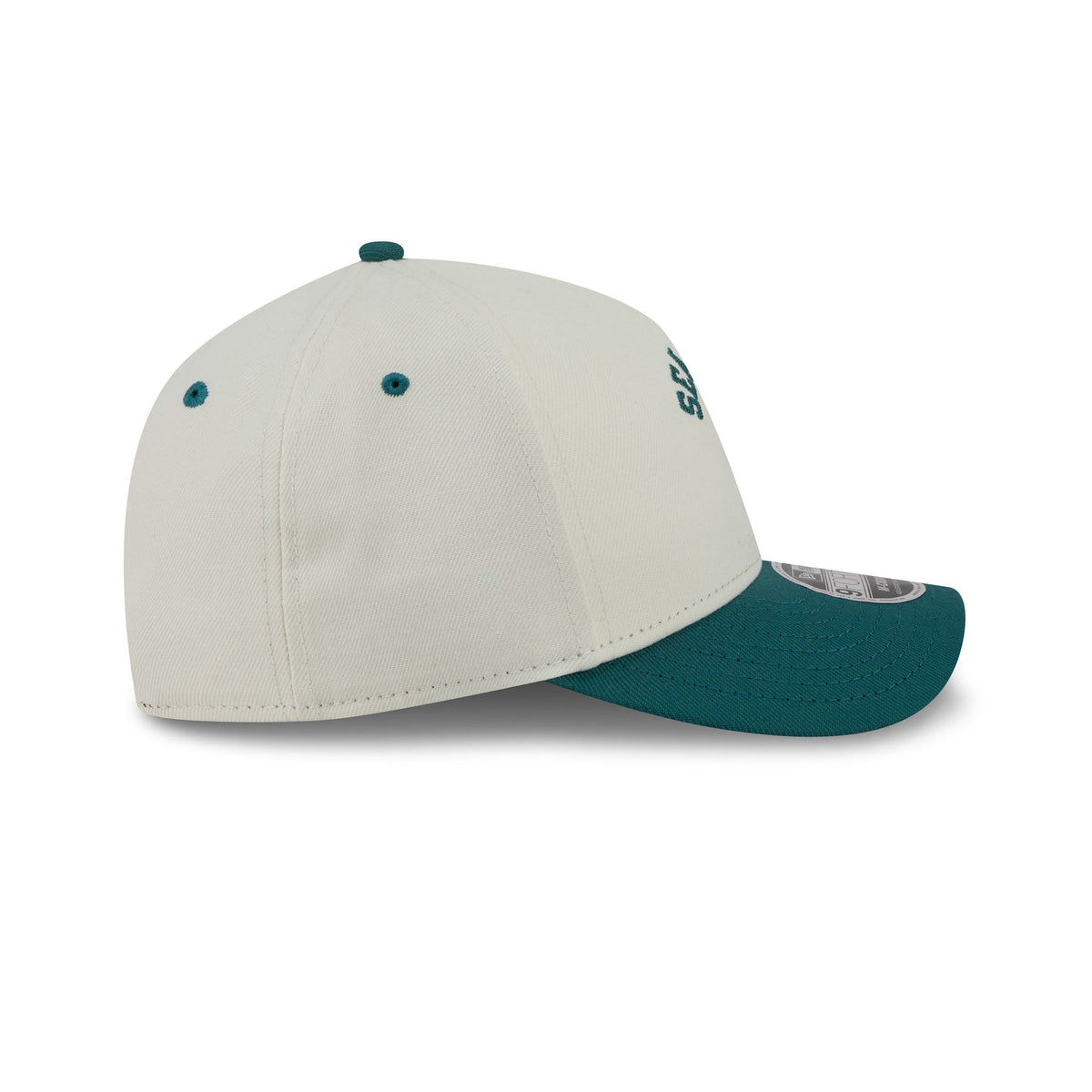 A structured baseball cap with an off-white crown and a dark teal visor and button, shown from a three-quarters angle on a white background.