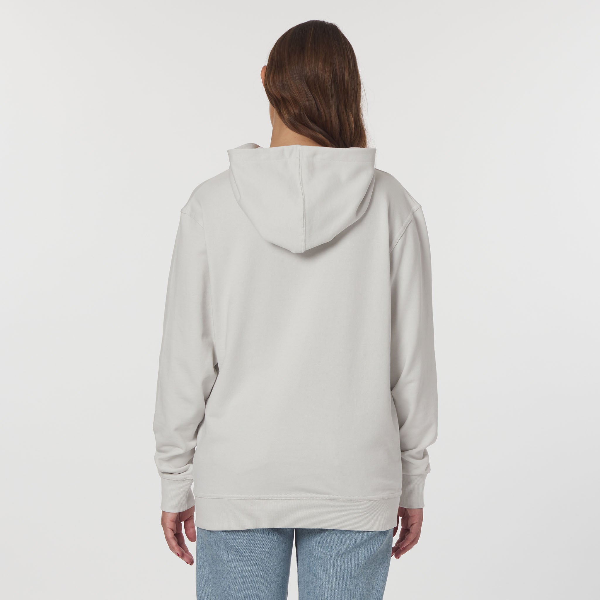 Person wearing a light gray hoodie on a white background