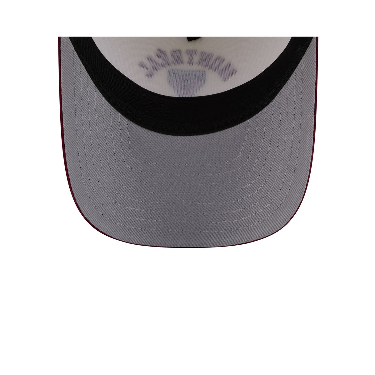 Close-up of the front of a baseball cap showing a white crown with 'MONTREAL' and a shield logo in gray, a black brim band, and a gray visor with a thin red edge on a white background.