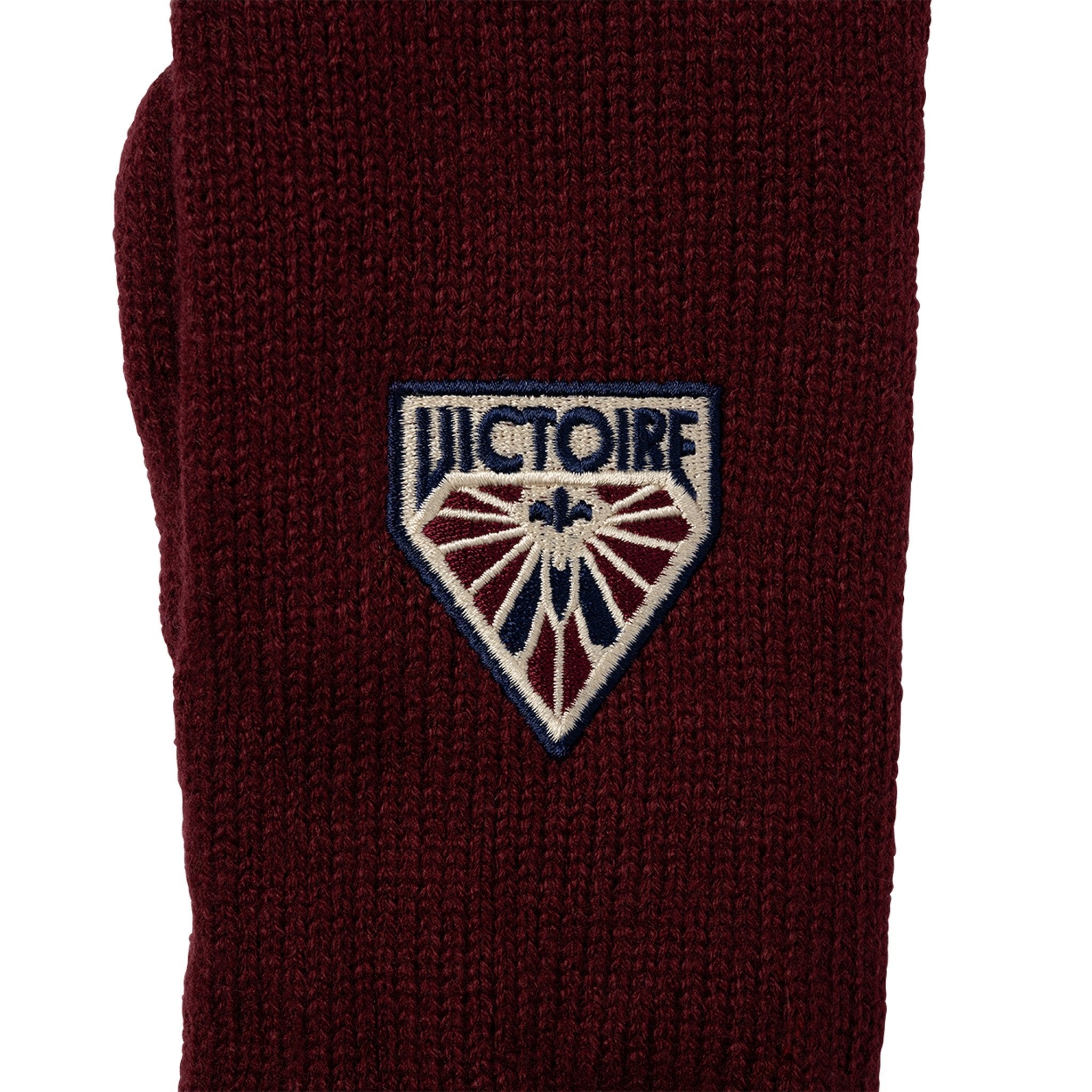 Maroon sock with 'Victoire' logo on a white background