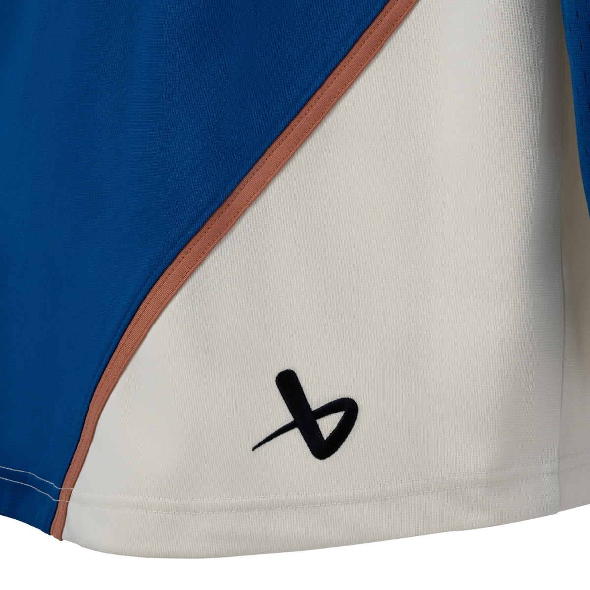 The back of the right hip is cream with a tan line above it. A black Bauer logo is in the bottom corner.