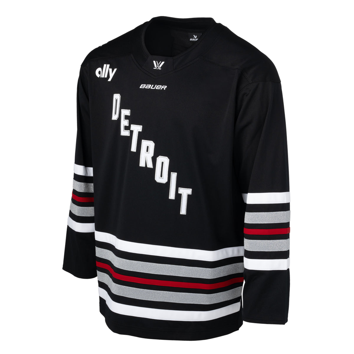 Front of a black jersey with red, white, and shimmering silver stripes on the sleeves and bottom hem. 'DETROIT' is in white with silver outlining diagonally across the chest. A white PWHL logo is on the front of the collar, a white Bauer logo below it, and a white Ally logo is on the right shoulder.
