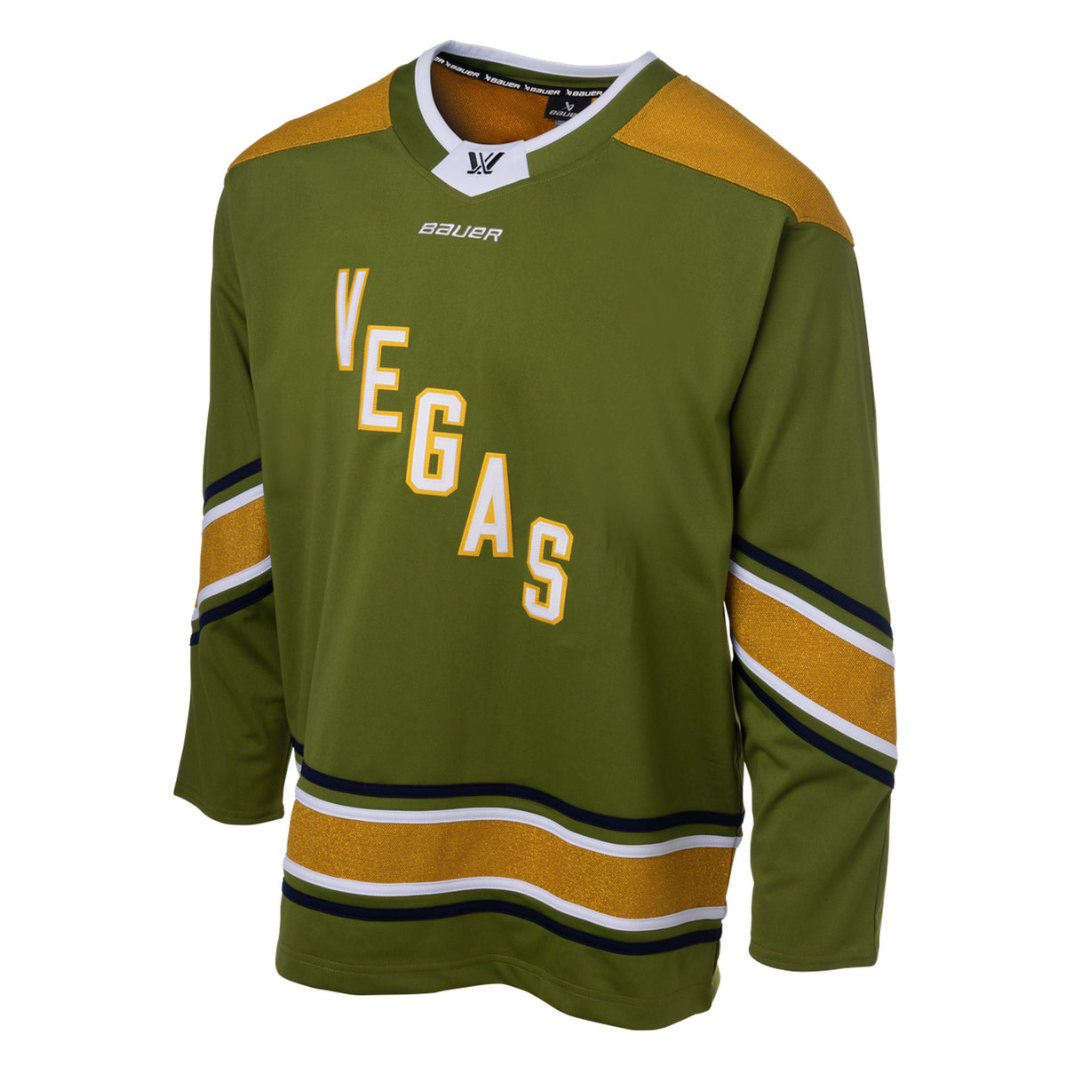 Front of a green jersey with sparkling gold shoulder caps and stripes along the sleeves and bottom hem surrounded by white and black stripes. In white outlined in gold reads 'VEGAS' diagonally across the chest. The collar is green with white trim on top. A black PWHL logo is centered on the collar with a white BAUER logo below it. 