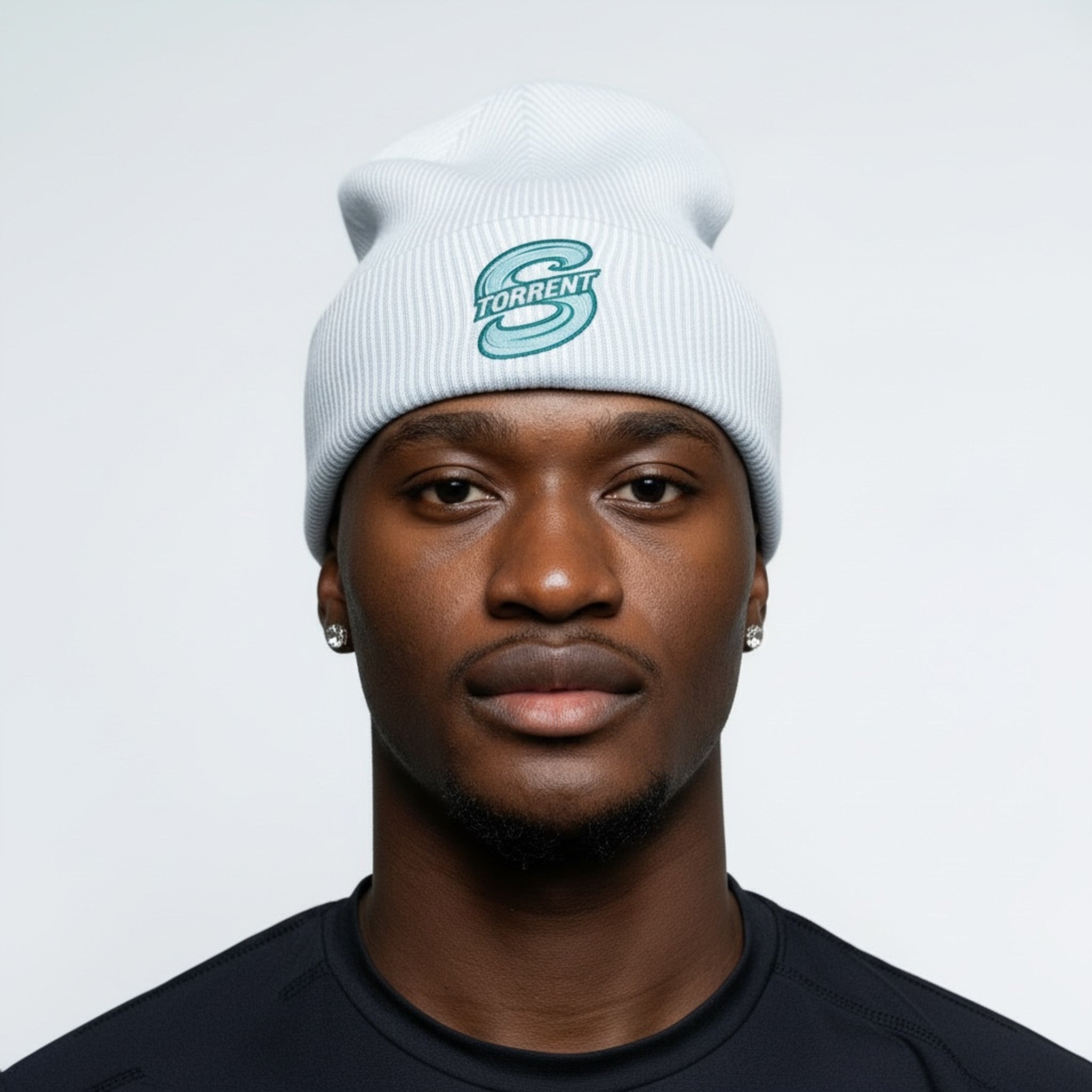 Person wearing a white beanie with a logo on a plain background