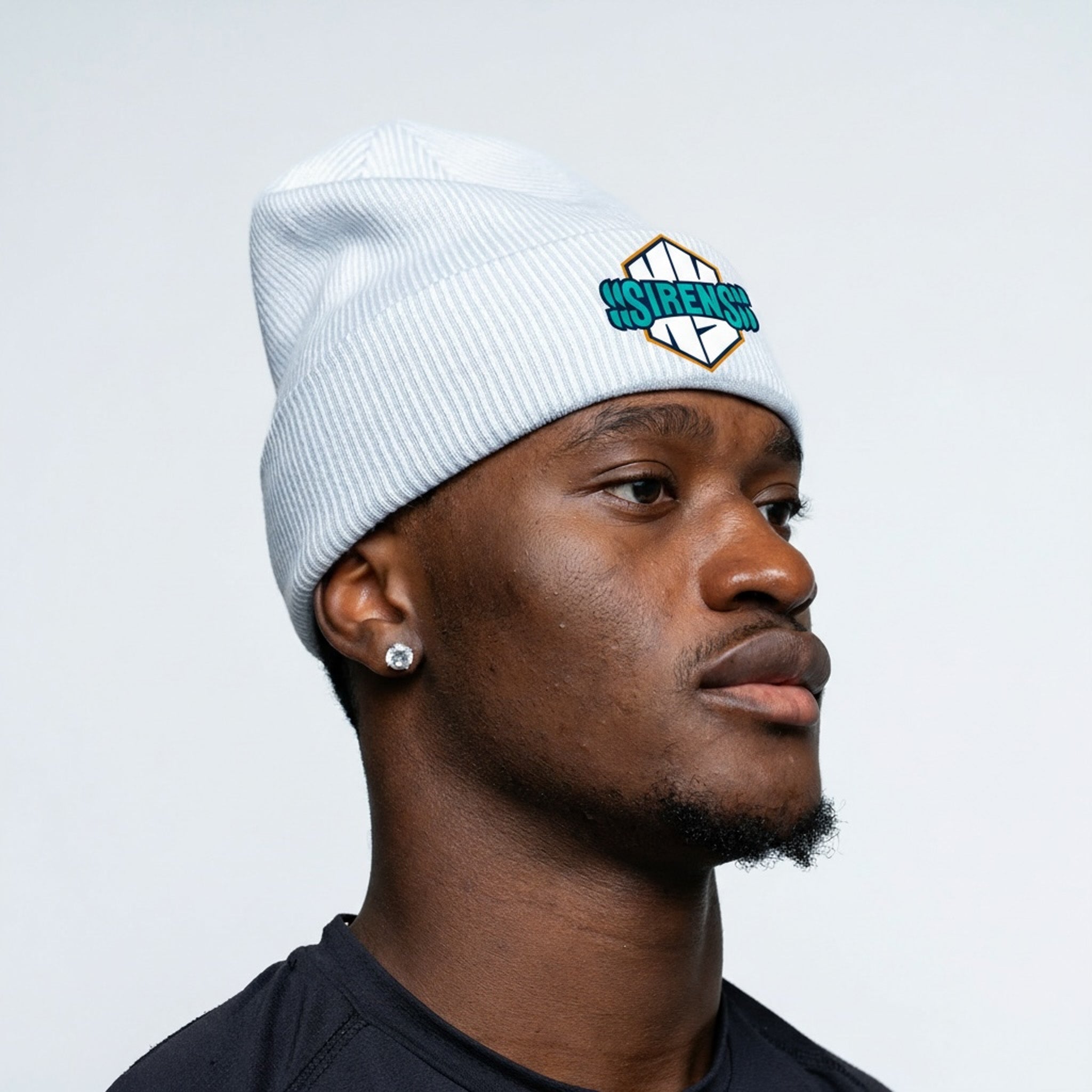Person wearing a white beanie with a logo on a light gray background