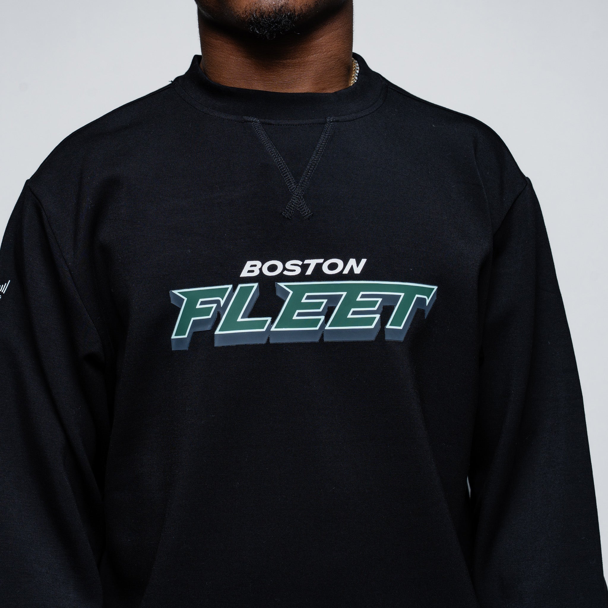 Black sweatshirt with 'Boston Fleet' text on a plain background