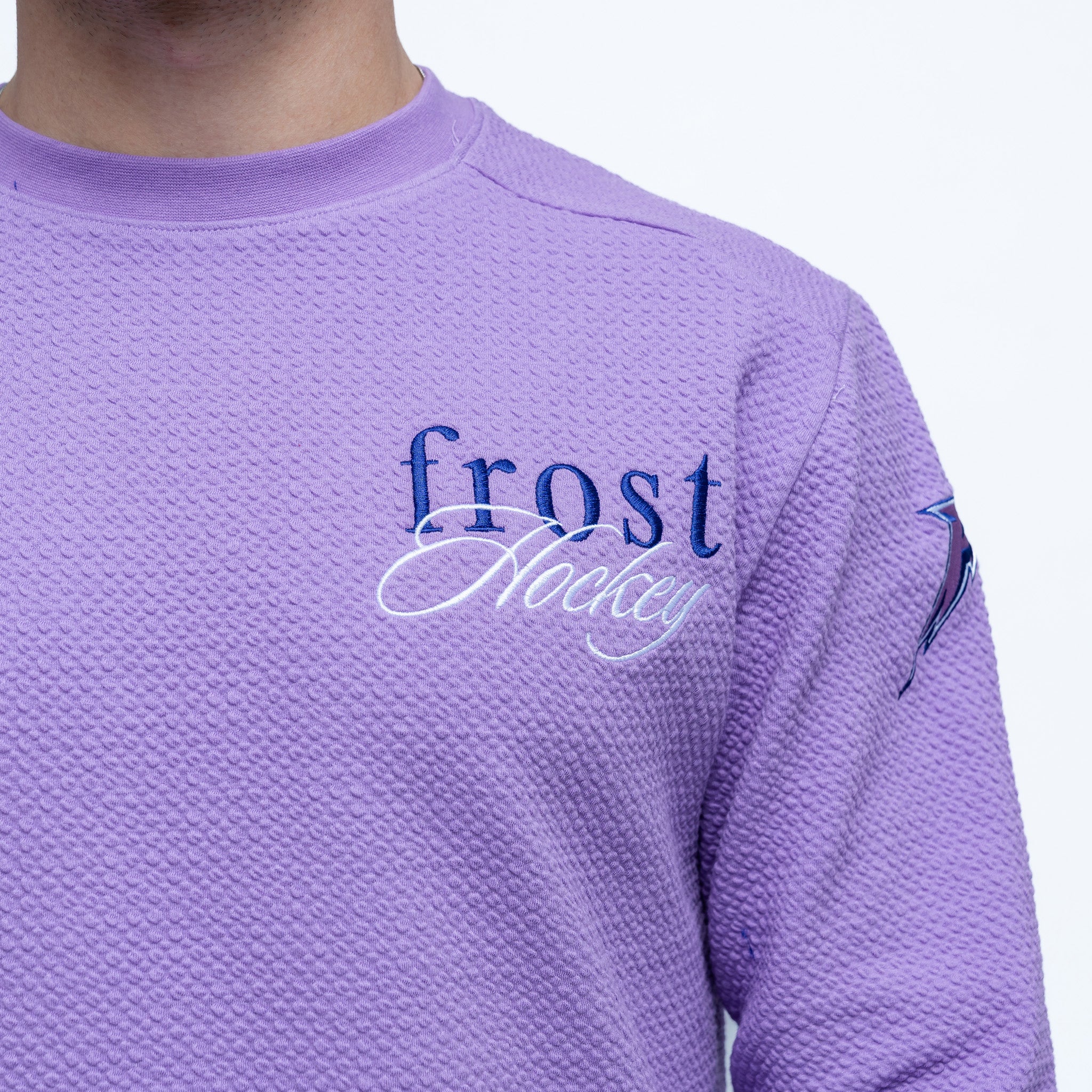 Purple hockey jersey with 'frost hockey' text on a white background