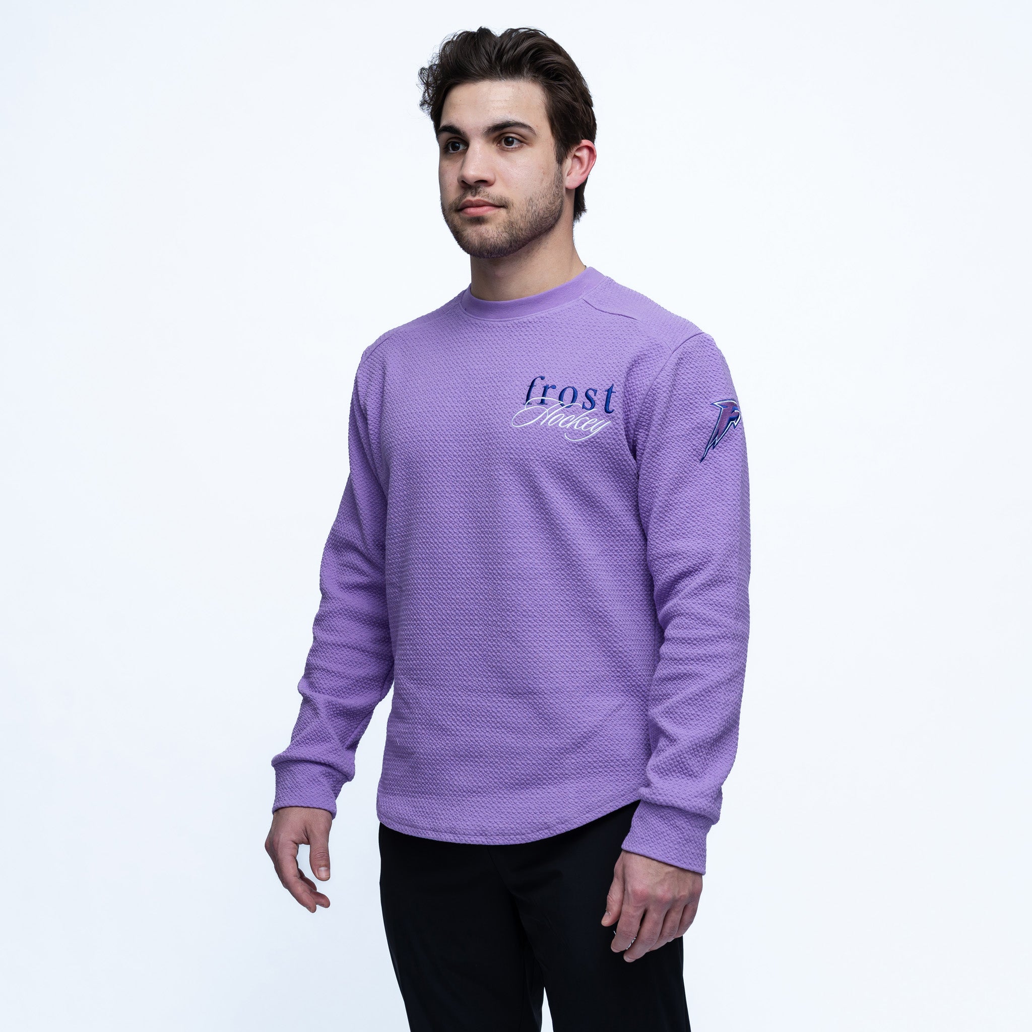 Man wearing a purple sweatshirt with 'frost' branding on a white background