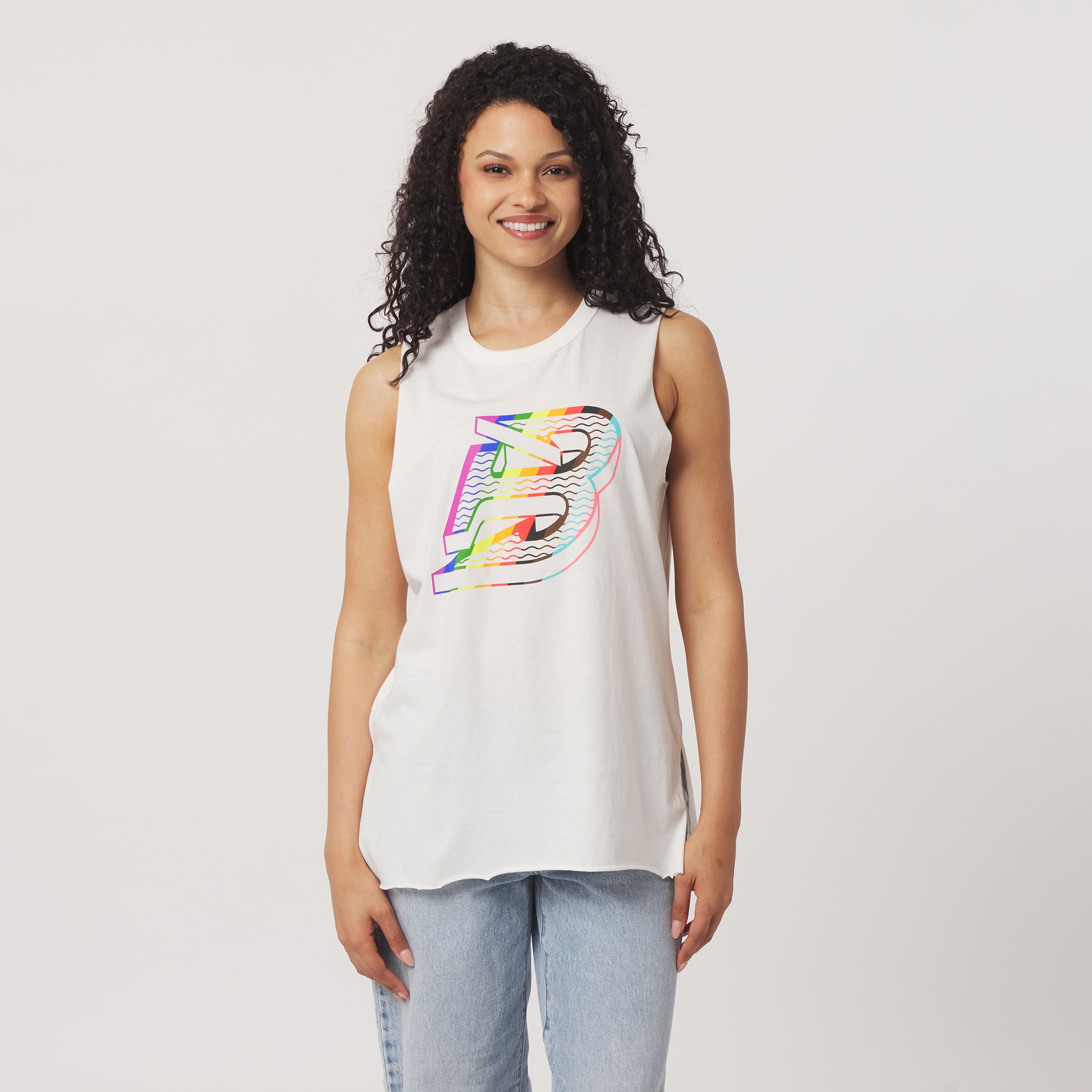 Woman wearing a white sleeveless shirt with a colorful logo on a plain background