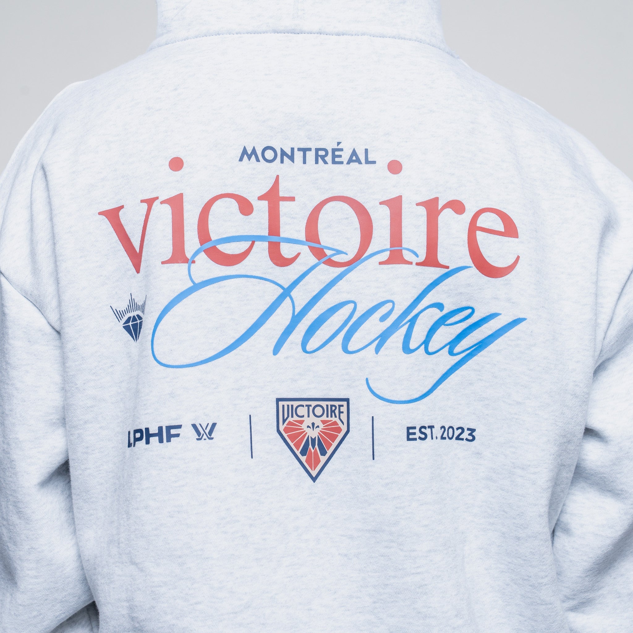Hoodie with 'Montreal Victoire Hockey' text and logos on the back