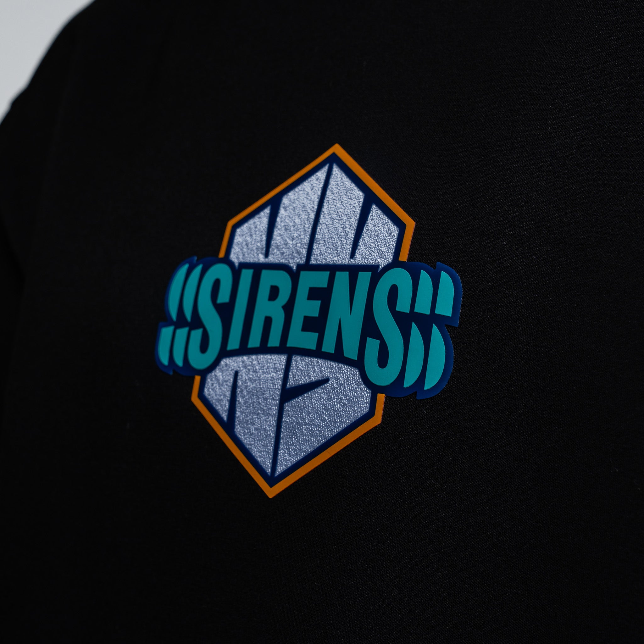 Embroidered logo on a black background