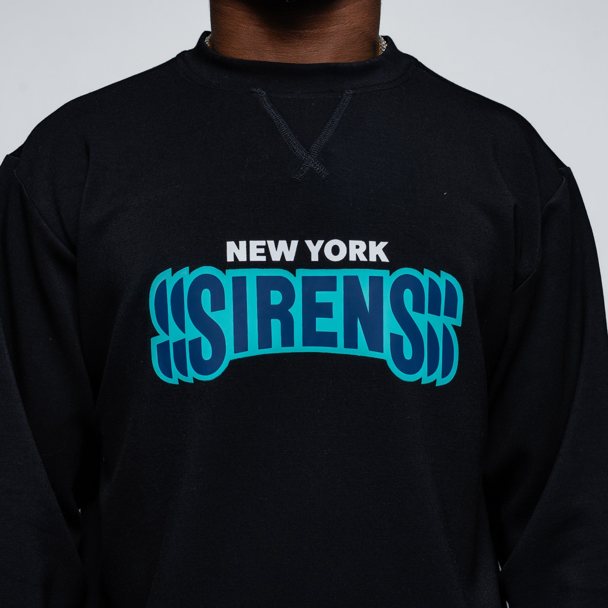 Black sweatshirt with 'New York Sirens' text in blue and white on a plain background