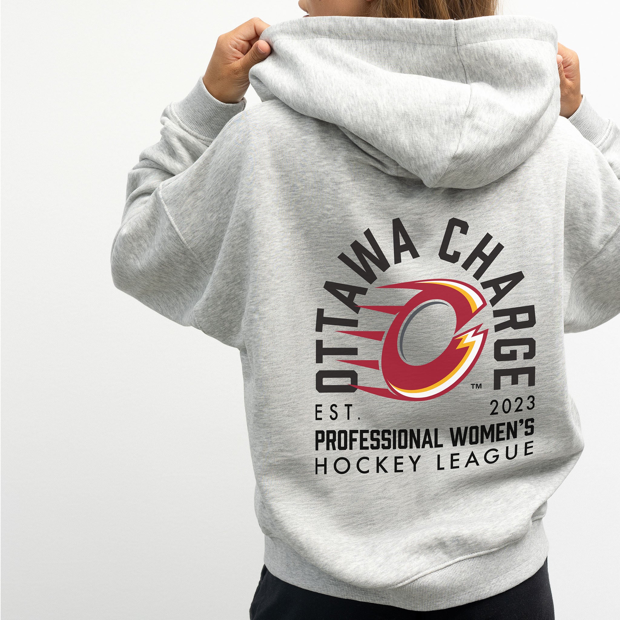 person wearing the Ottawa Charge grey zip-up hoodie with a graphic design on the back