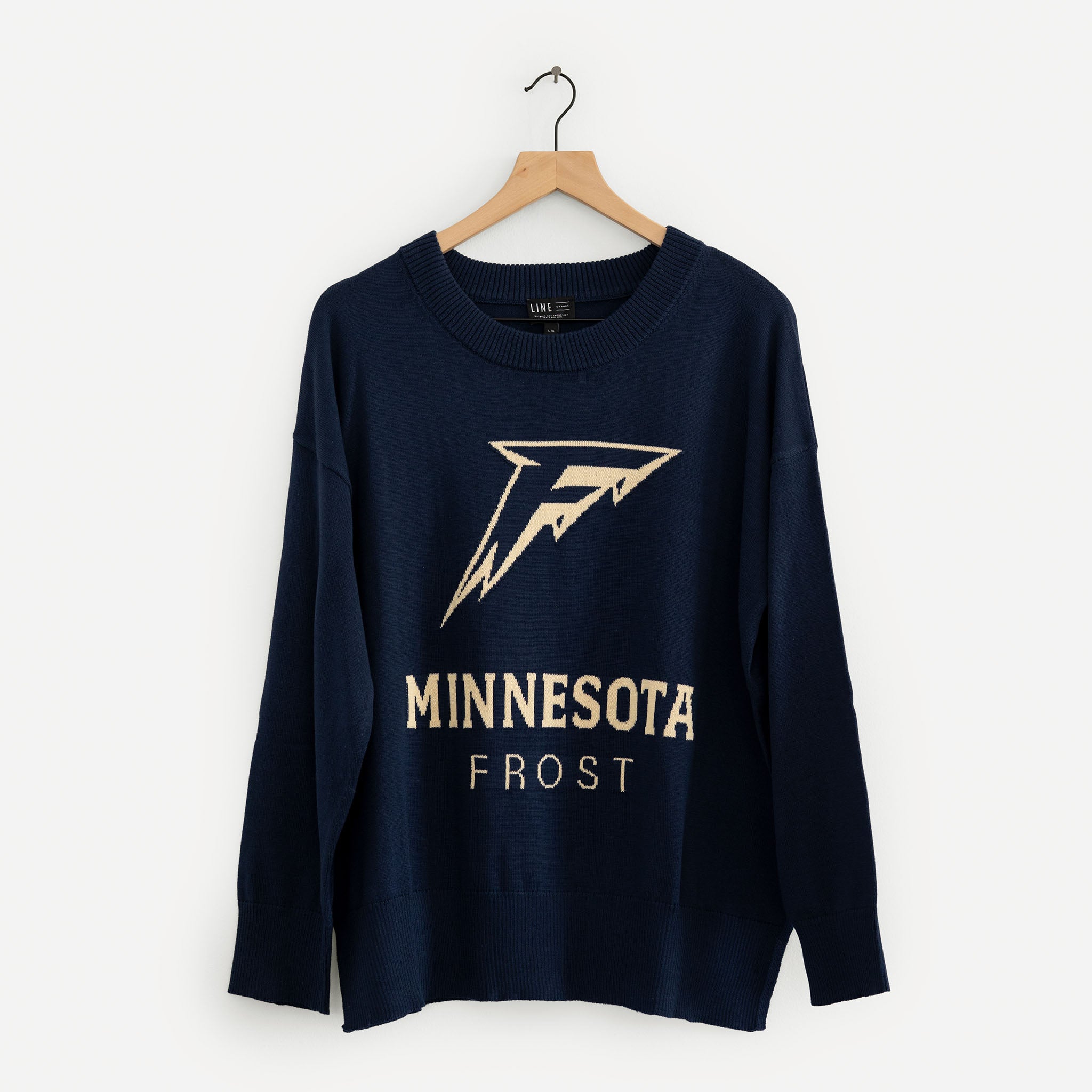 Navy blue sweatshirt with 'Minnesota Frost' text and logo on a hanger against a white background