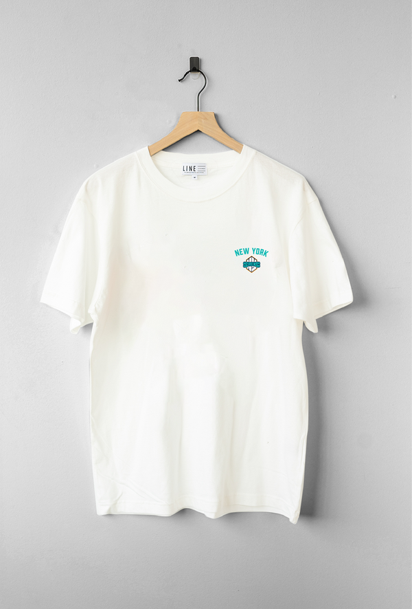 New York Sirens T-shirt – White base with teal and black print, side view highlighting oversized fit and sleeve detail