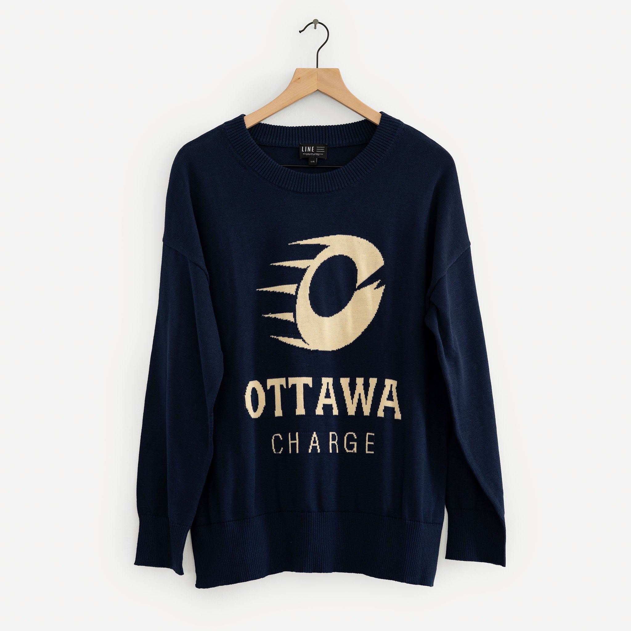 Navy blue sweatshirt with 'Ottawa Charge' logo on a hanger against a white background