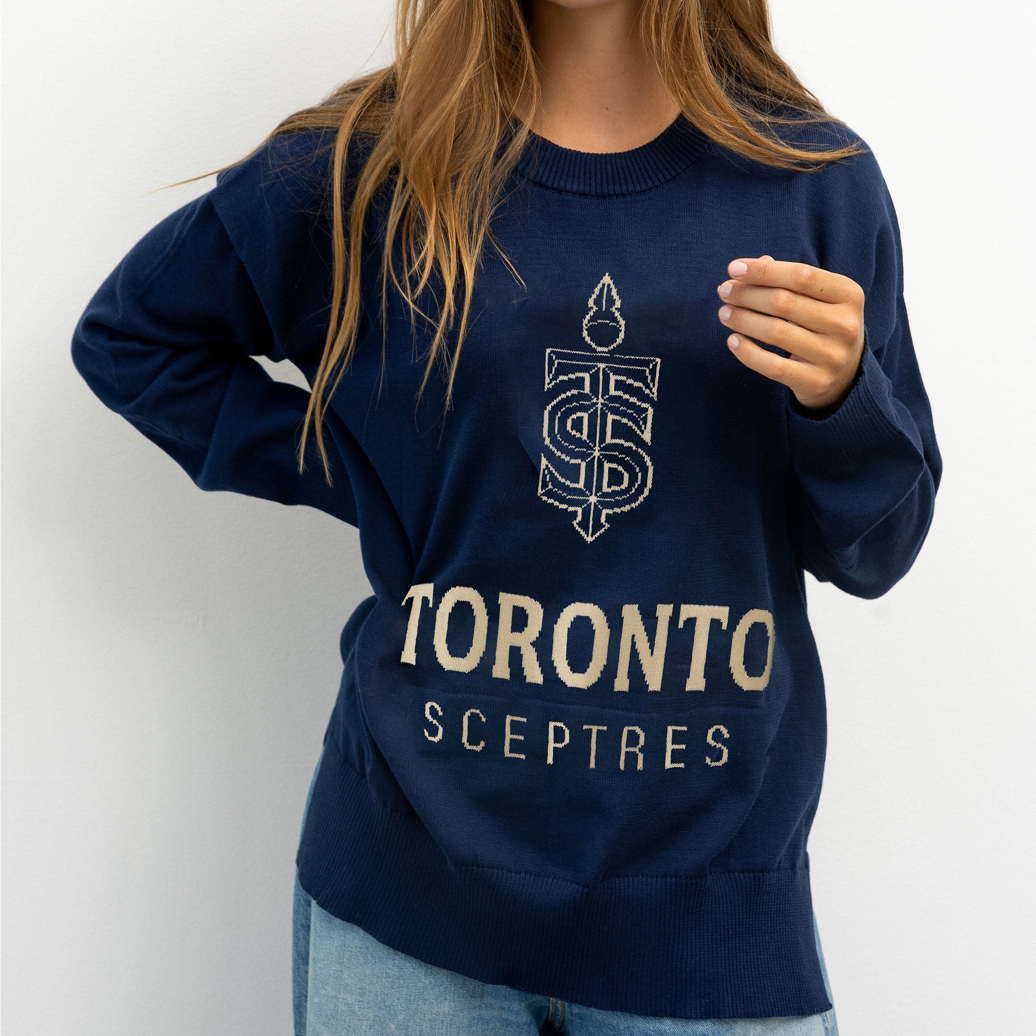 Navy blue sweatshirt with 'Toronto Sceptres' text and logo worn by a person on a white background