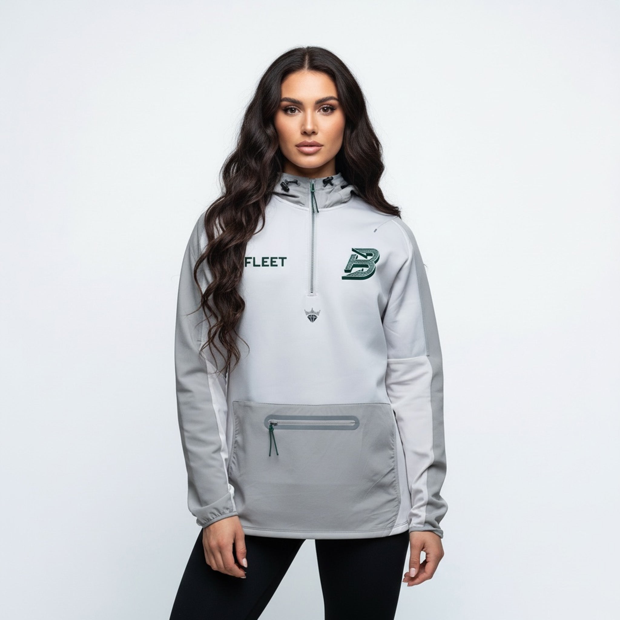 Woman wearing a gray jacket with logos on a white background