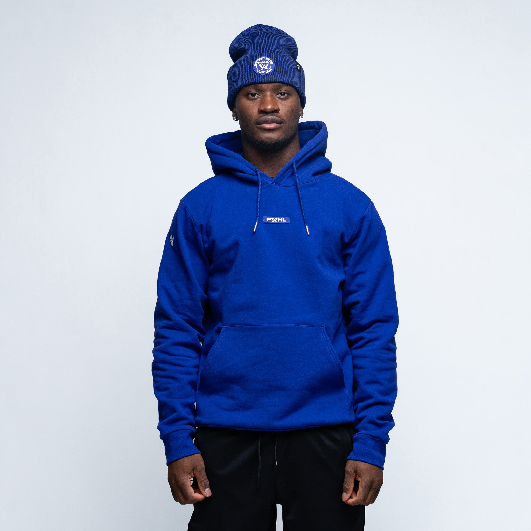 Person wearing a purple hoodie and beanie with a logo on a white background