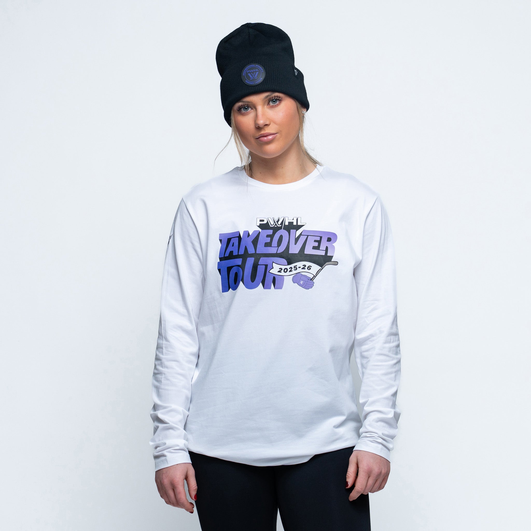 Person wearing white long sleeve shirt with "PWHL Takeover Tour 2025-26" graphic