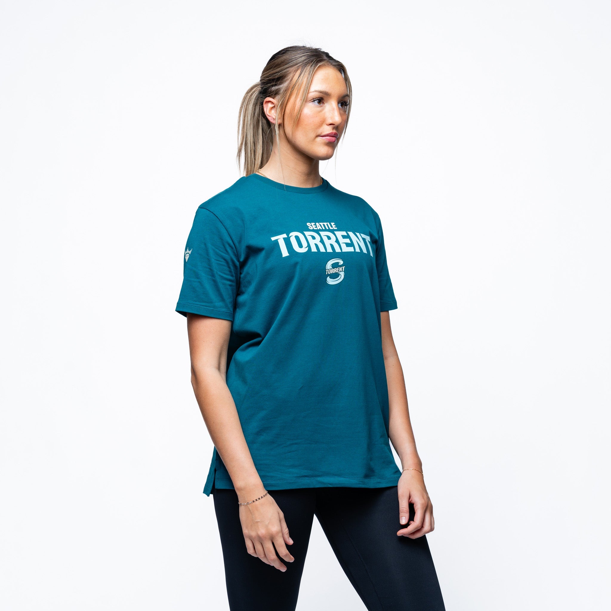 Woman wearing green Adult Seattle Torrent Royalty Local Sideline T-Shirt side angle