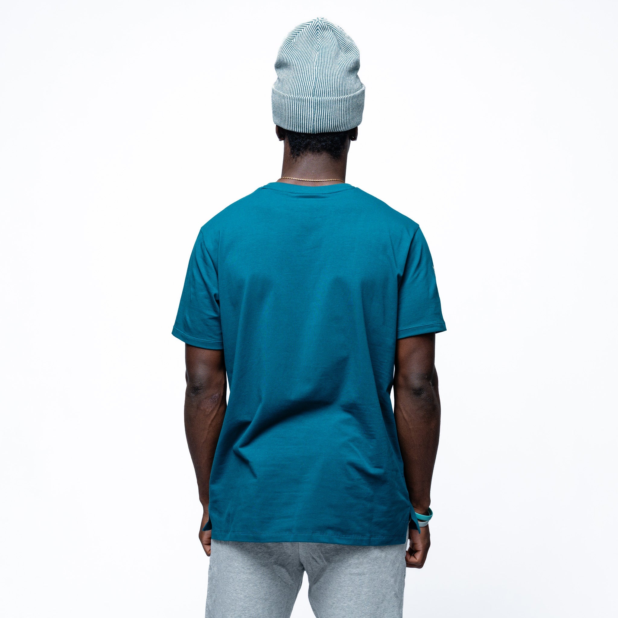 Person wearing green Adult Seattle Torrent Royalty Essential Sideline T-Shirt back angle