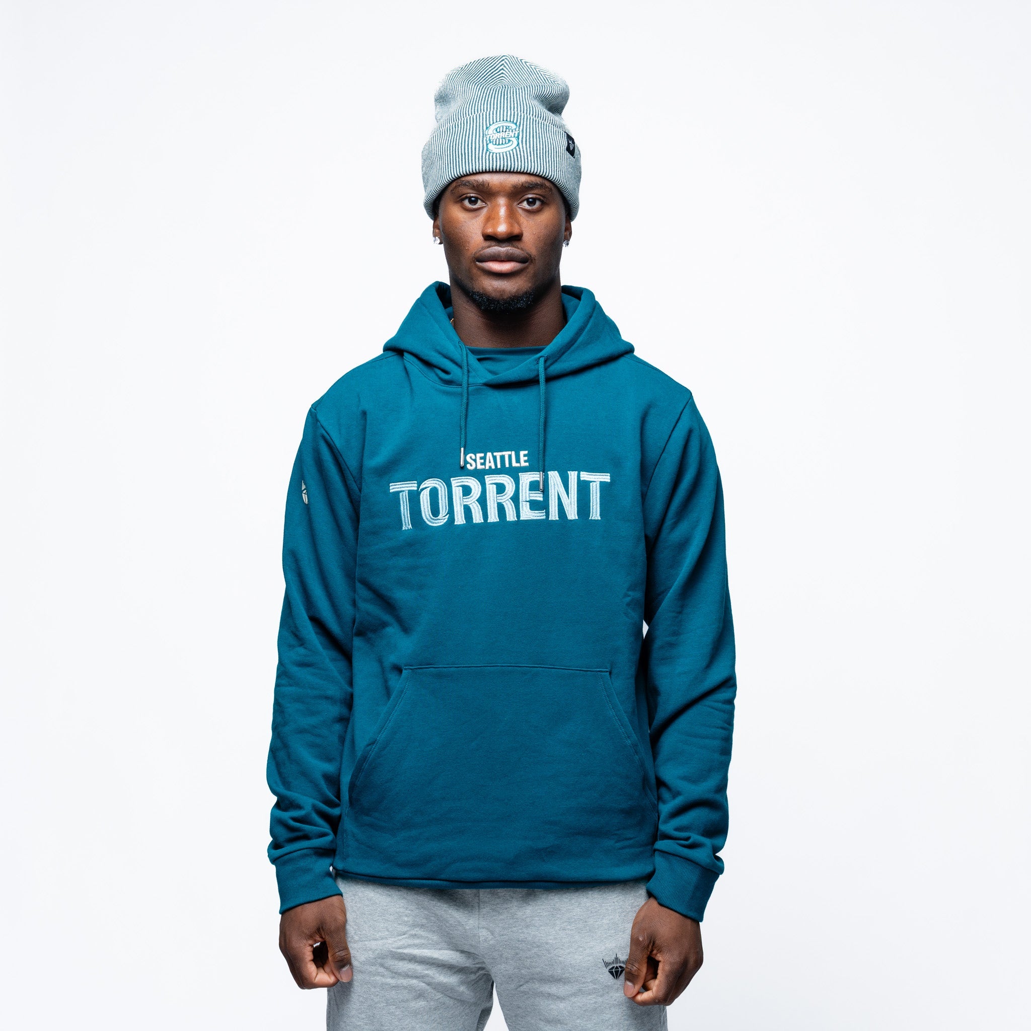 Man wearing the green Adult Seattle Torrent Royalty Heritage Cloud Hoodie
