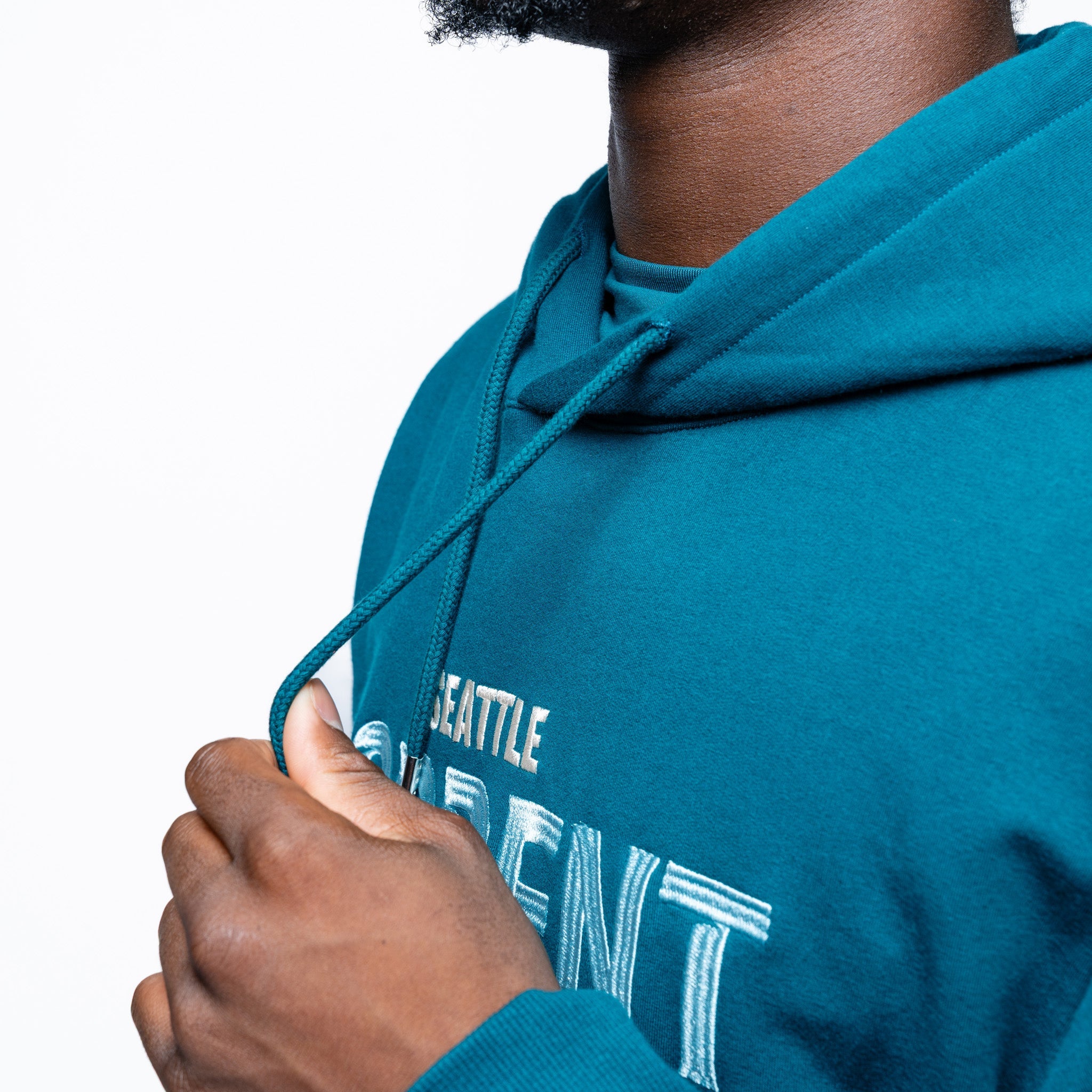 Close up on the drawstrings on the green Adult Seattle Torrent Royalty Heritage Cloud Hoodie
