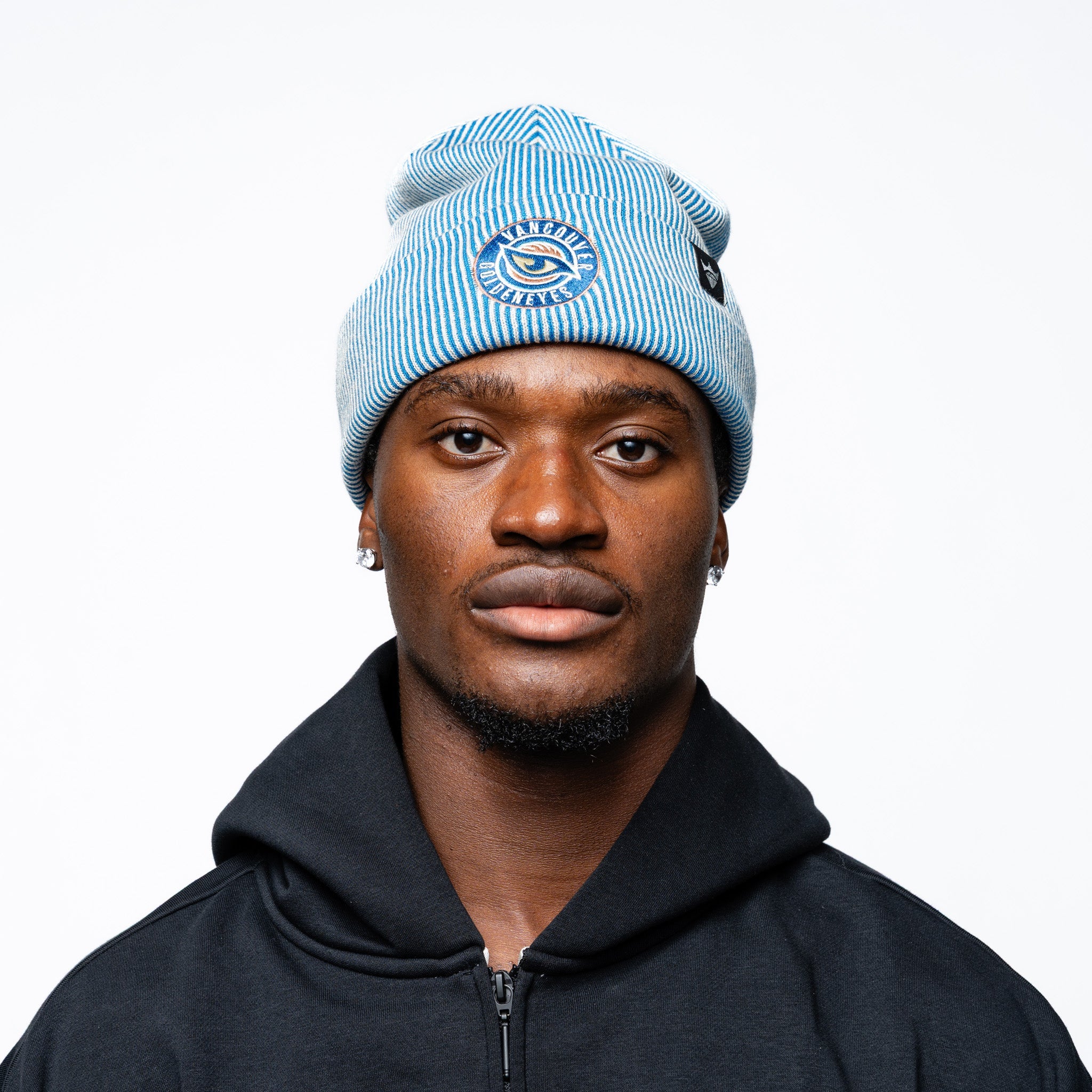 Man wearing blue Adult Vancouver Goldeneyes Royalty Double Knit Beanie front angle