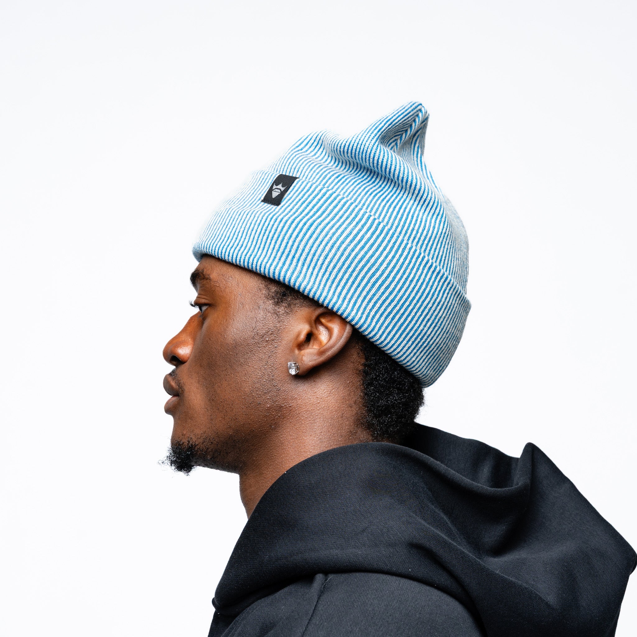 Man wearing blue Adult Vancouver Goldeneyes Royalty Double Knit Beanie other side angle