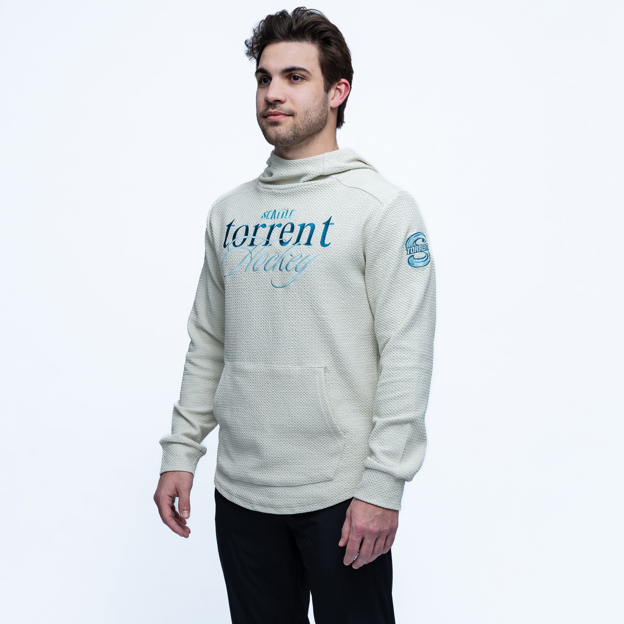 Man wearing a light gray hoodie with text on a white background