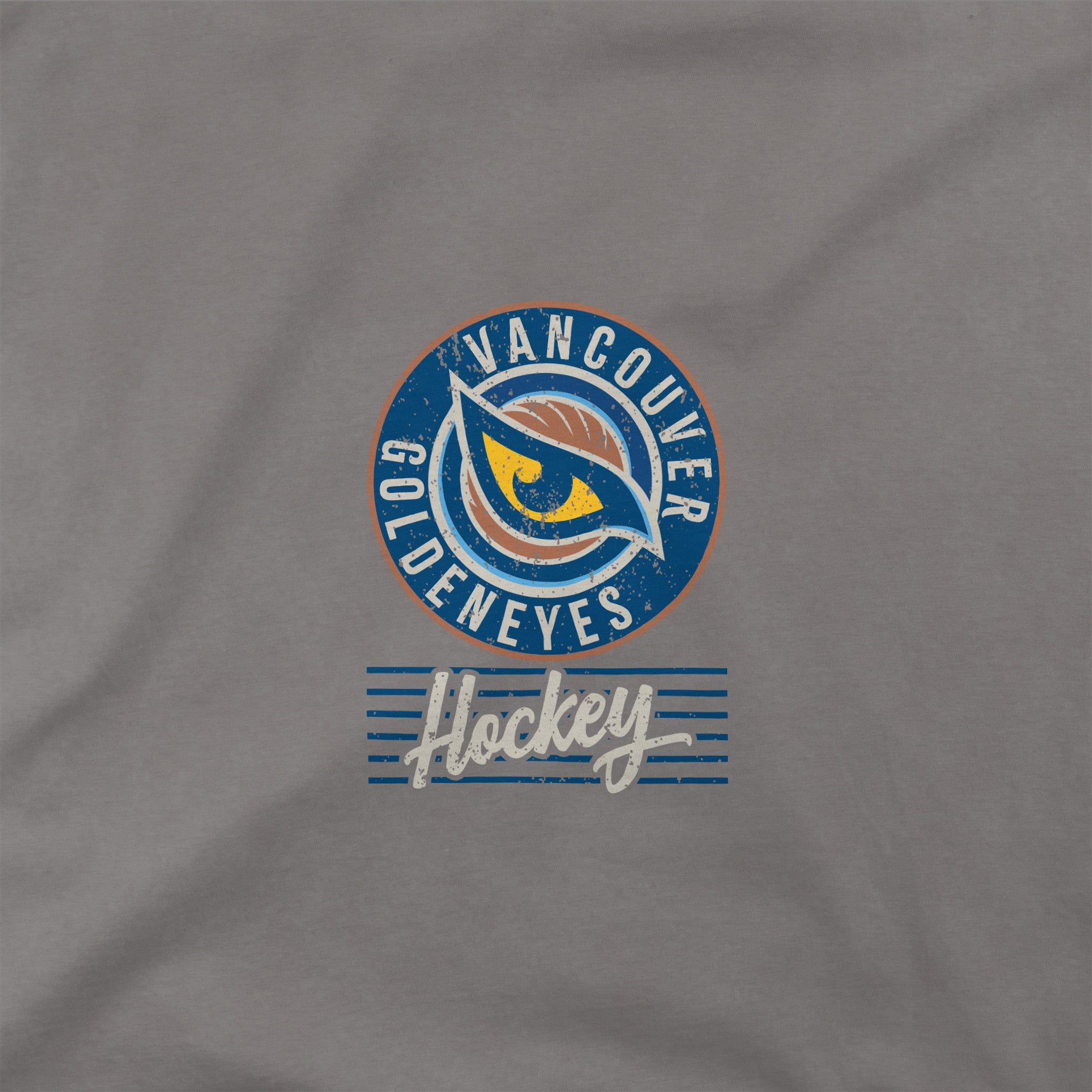 Close up of the front graphic on the Adult Vancouver Goldeneyes Stadium Essentials Laylow Vintage T-Shirt