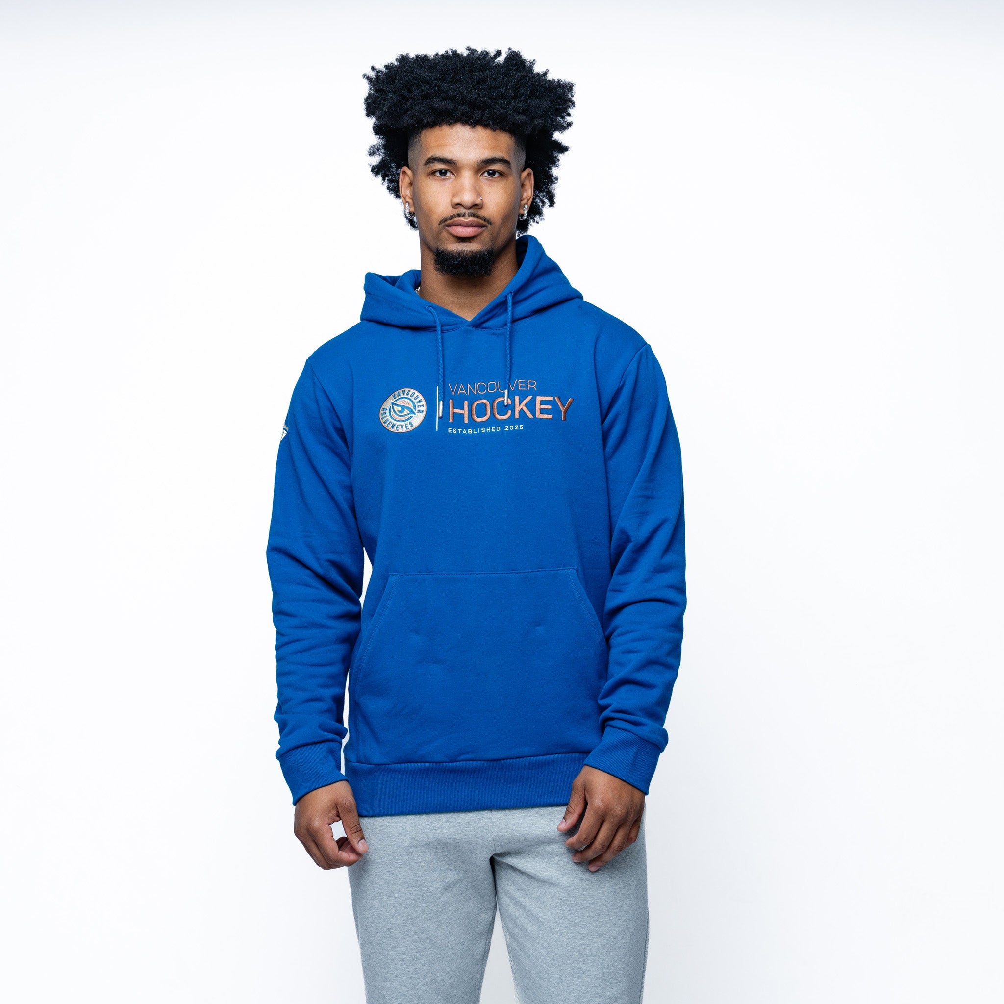 Man wearing blue Adult Vancouver Goldeneyes Royalty Citymark Cloud Hoodie