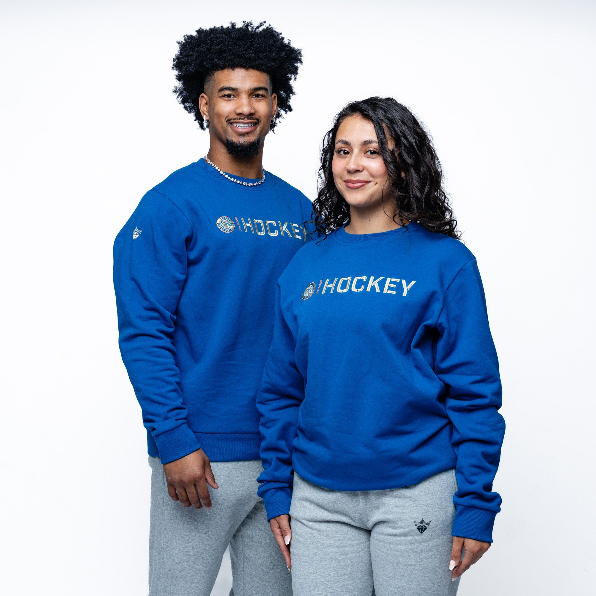 Man and woman wearing blue Adult Vancouver Goldeneyes Royalty Everyday Cloud Crew side angle